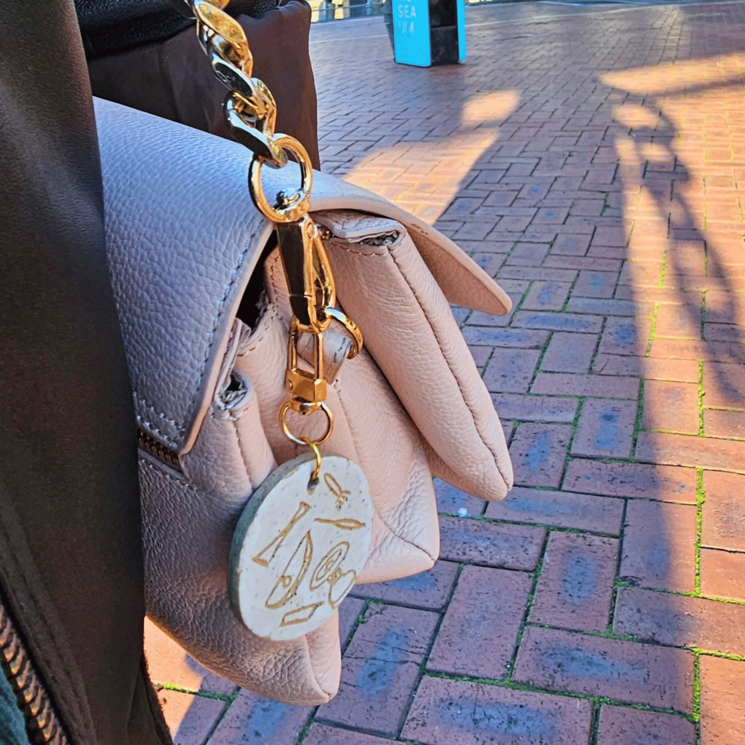 Bag Buddies_sgraffito_white glaze_pink bag.png