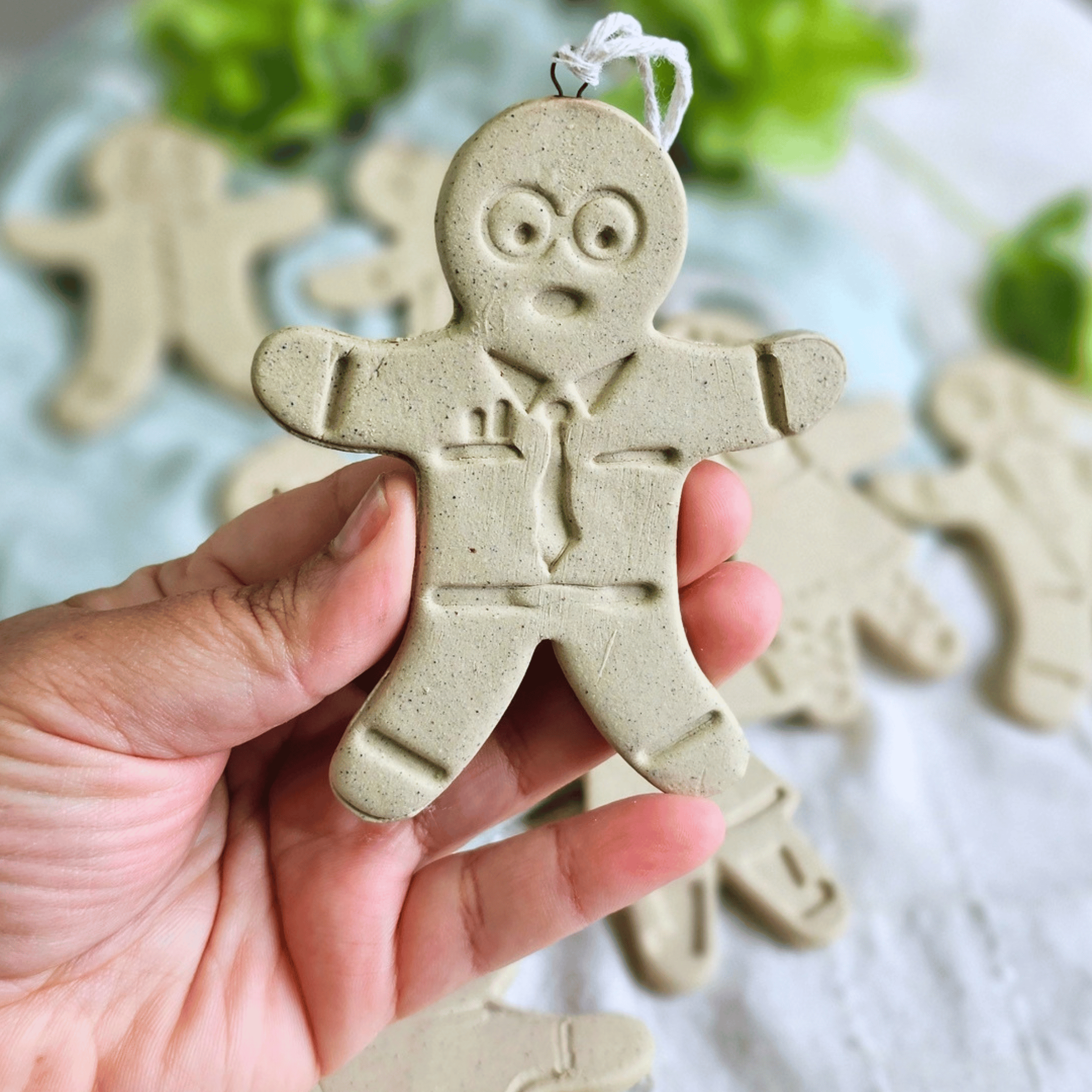 Gingies_raw clay_flatlay_in hands_geek.png