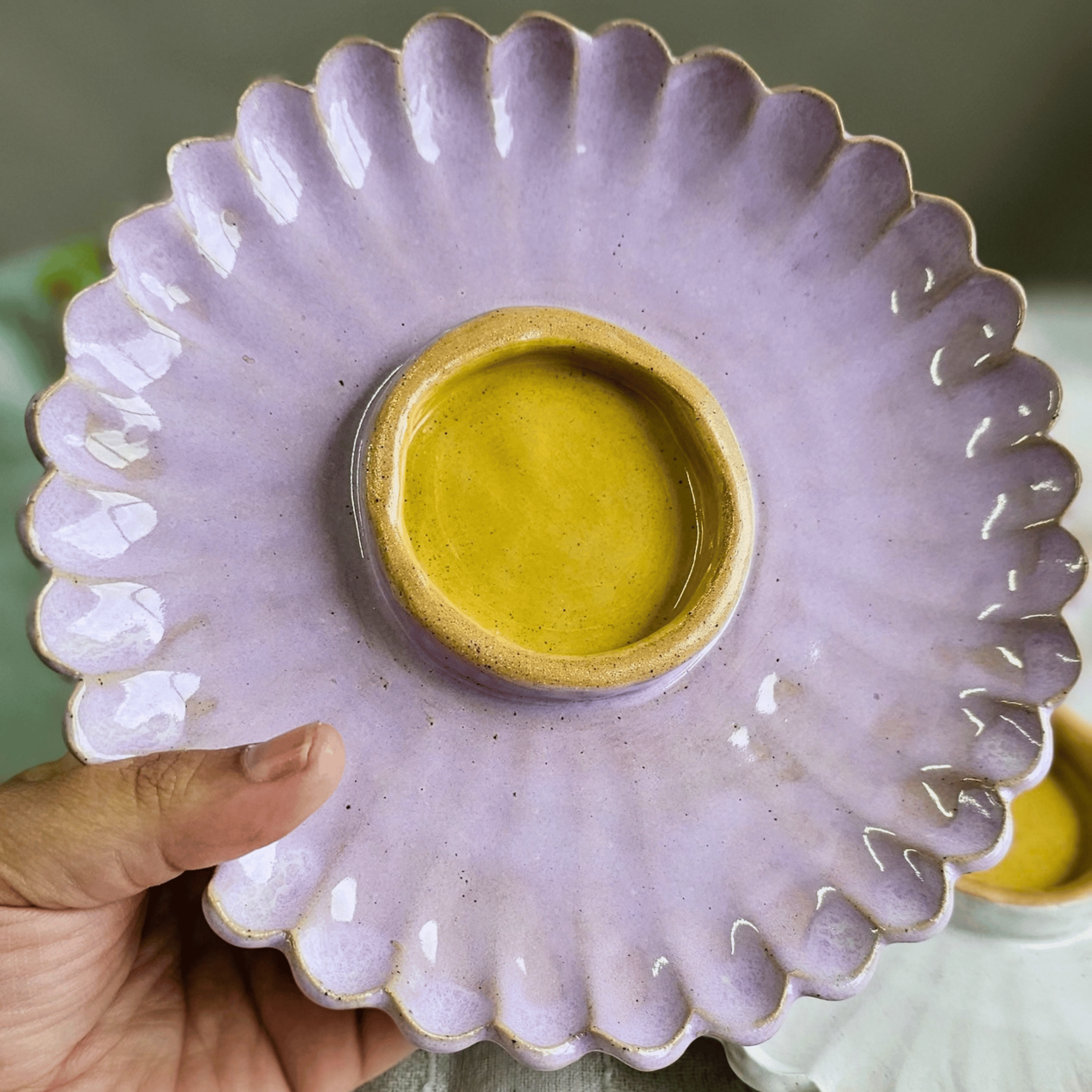 Girl Dinner Plates_Flower shaped_pink yellow_in hand_top.png