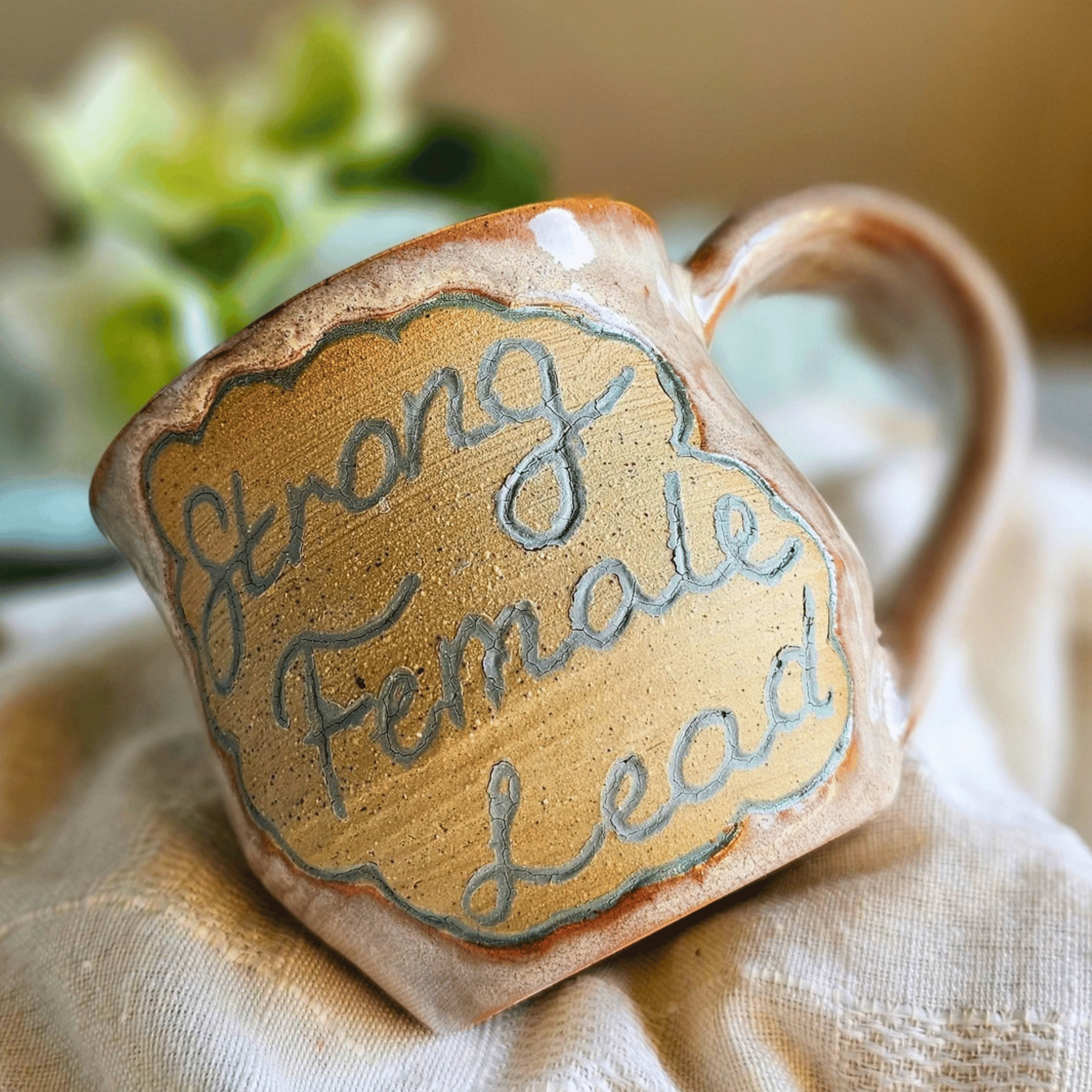 Smug Mug_handled_hand carved_female lead_front.png