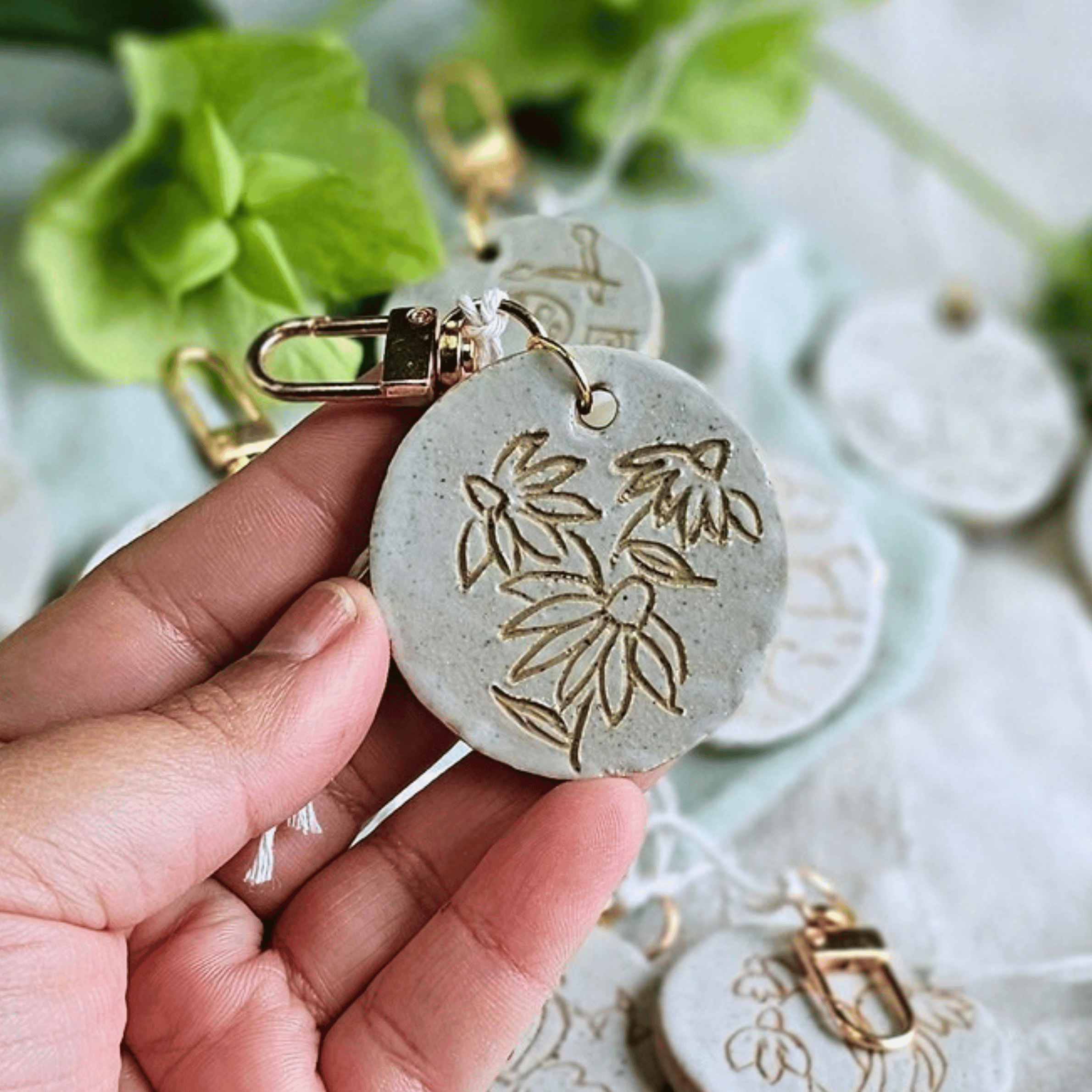 Bag Buddies_sgraffito_white glaze_flowers.png