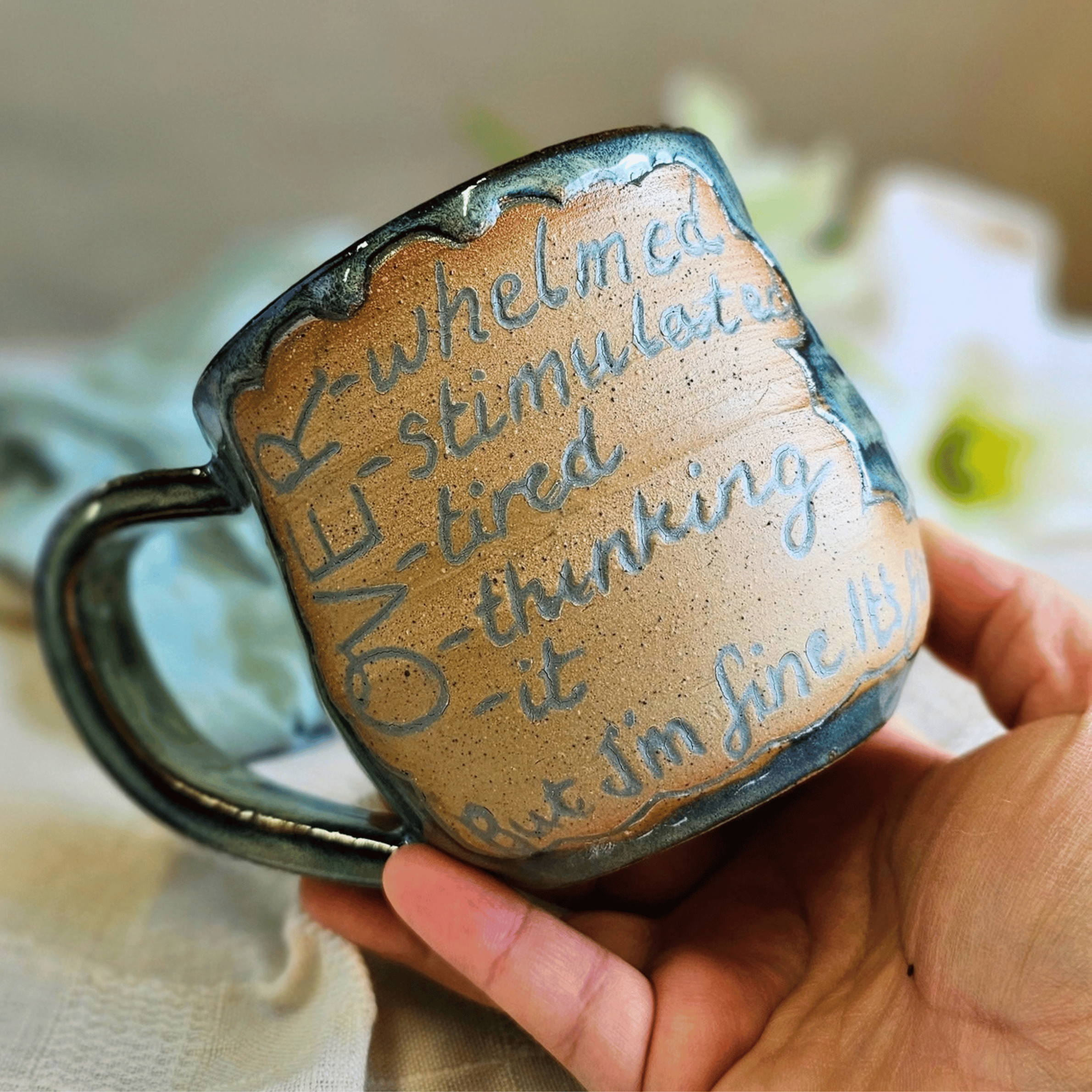 Smug Mug_handled_hand carved_over it_in hand.png
