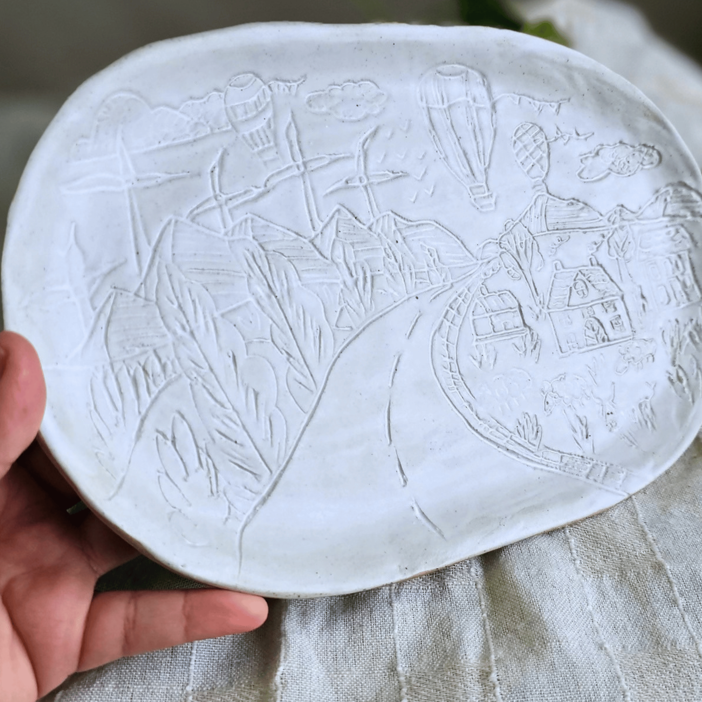 Valley Board_white glaze_sgraffito_in hand.png