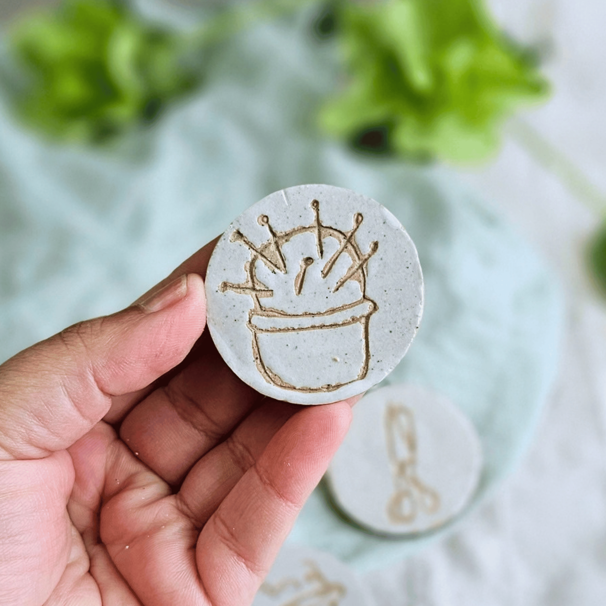 Pattern Weights_sgraffito_white glaze_pin cushion.png