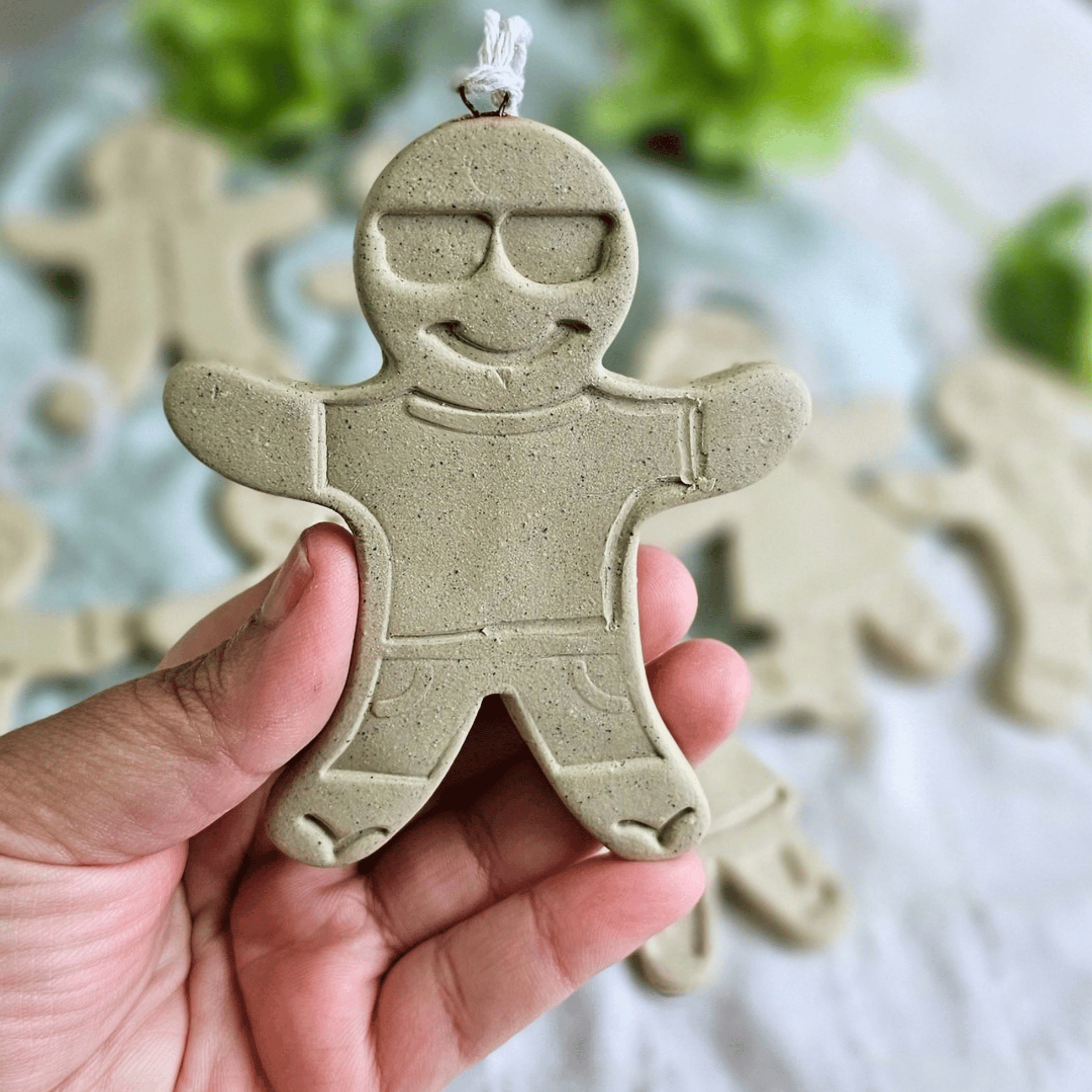 Gingies_raw clay_flatlay_in hands_cool dude.png