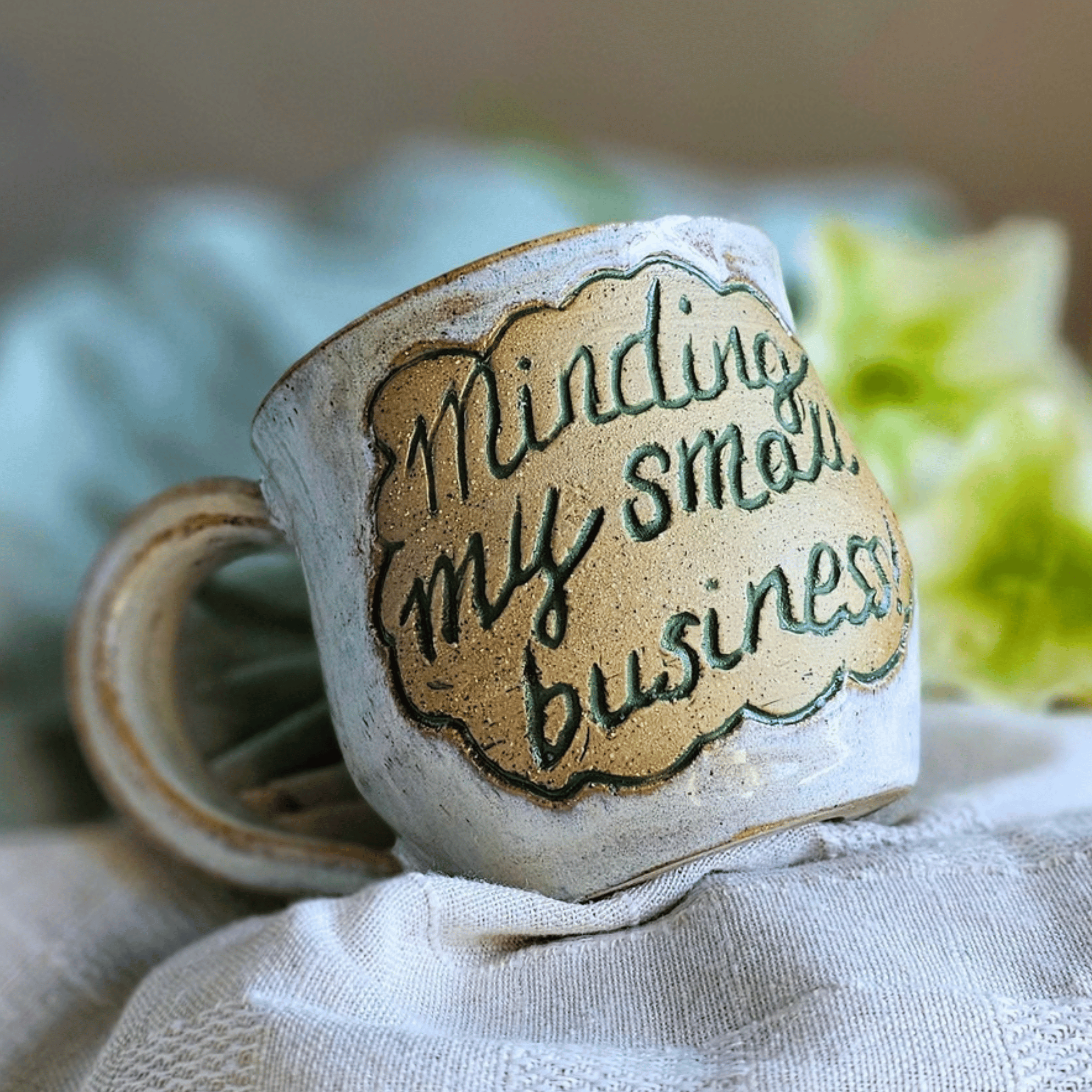 Smug Mug_handled_hand carved_business_front.png