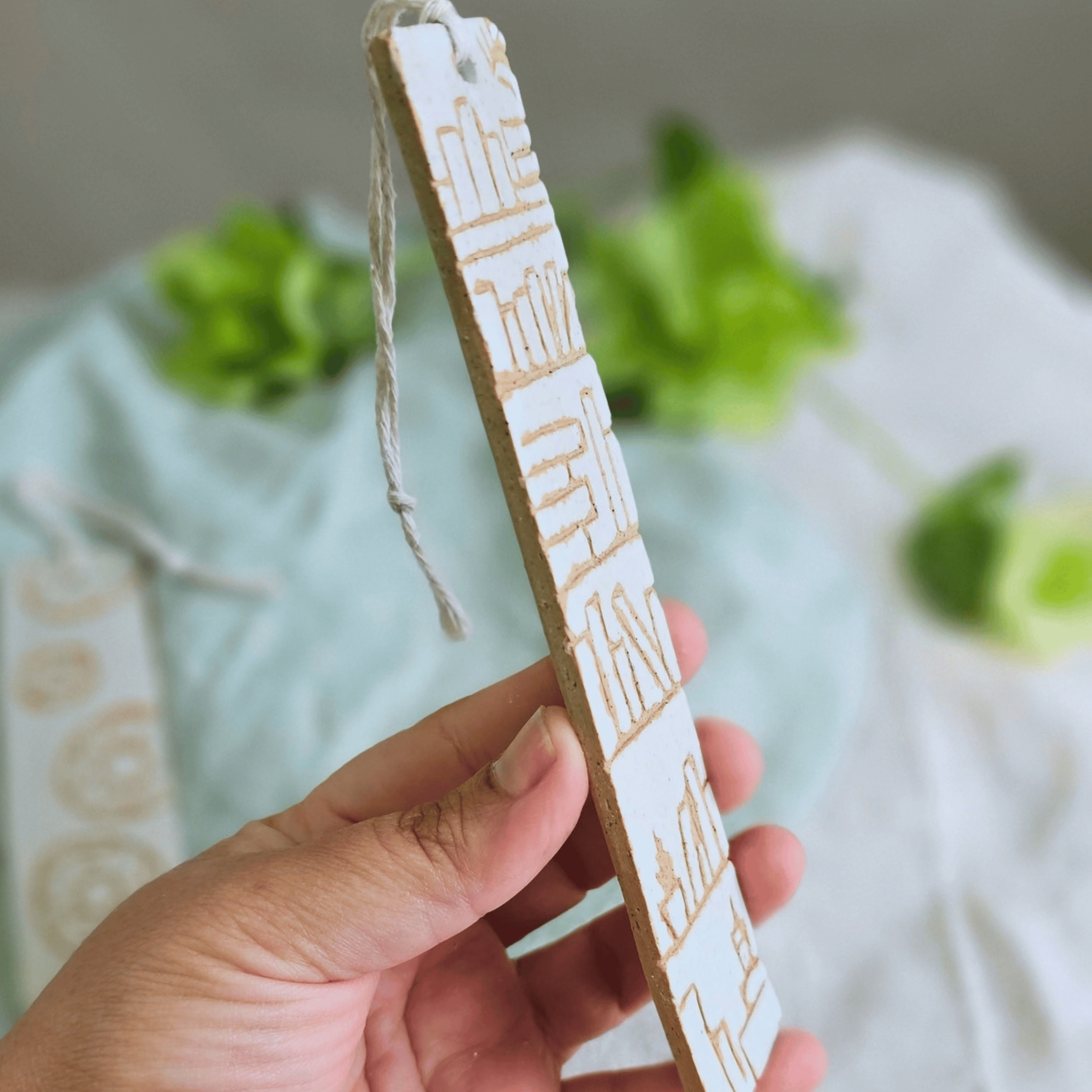 Book Marks_sgraffito_white glaze_bookshelf_side view.png
