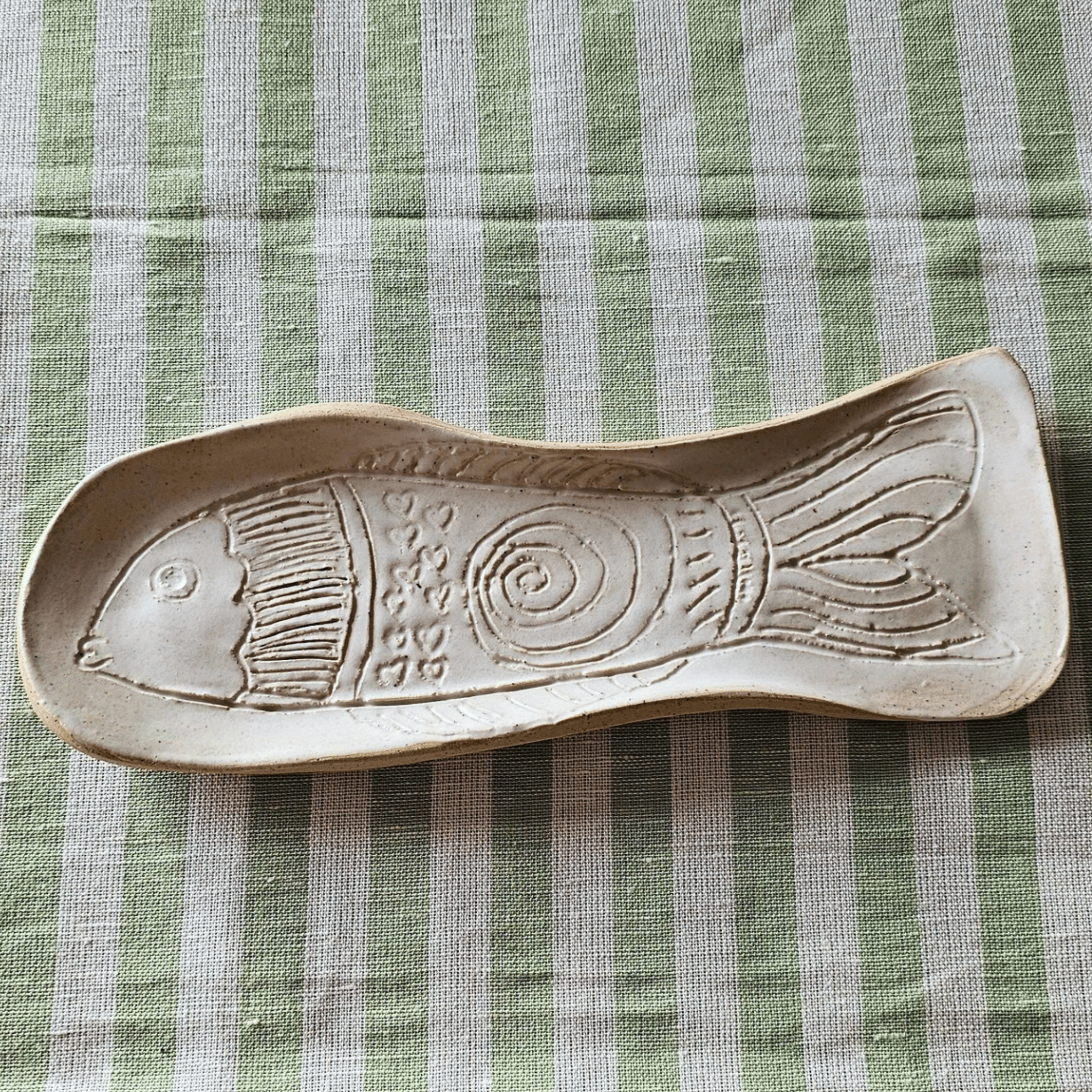 Just Keep Swimming_group_flatlay_curved trays_spiral fish.png