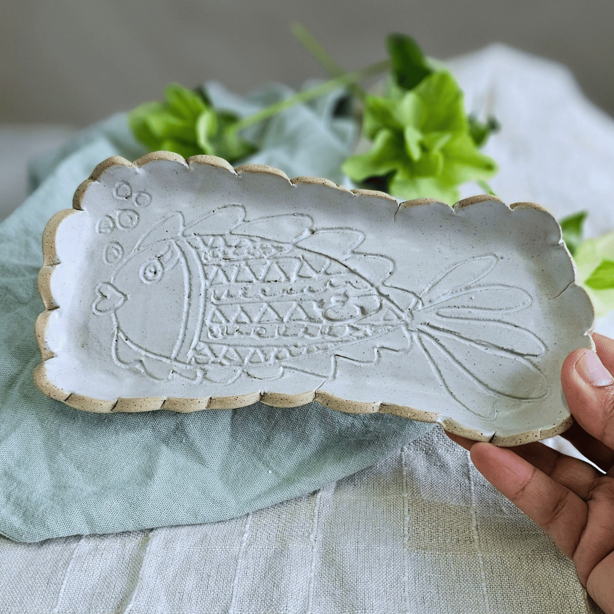 Just Keep Swimming_group_flatlay_curved trays_scalloped_in hand.png