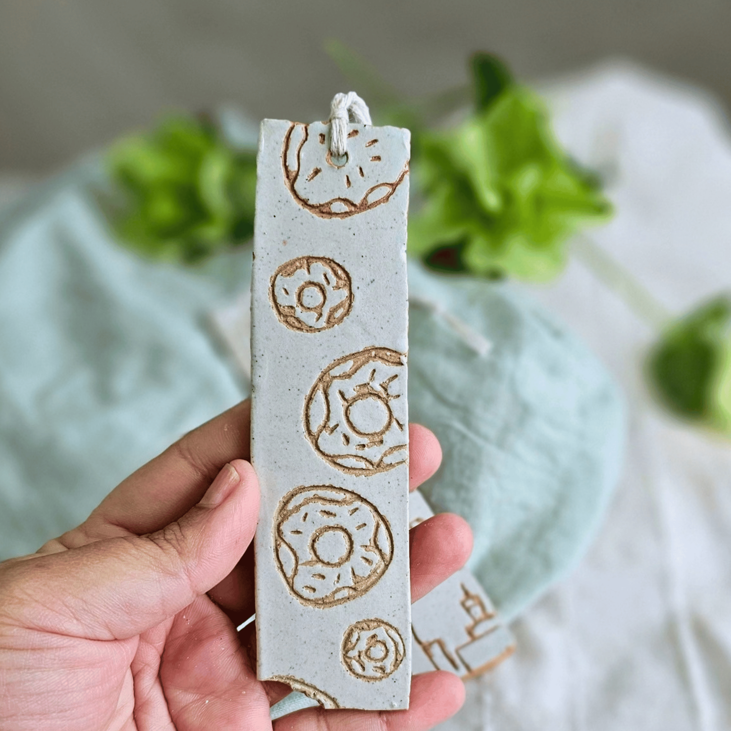 Book Marks_sgraffito_white glaze_bitten doughnuts.png