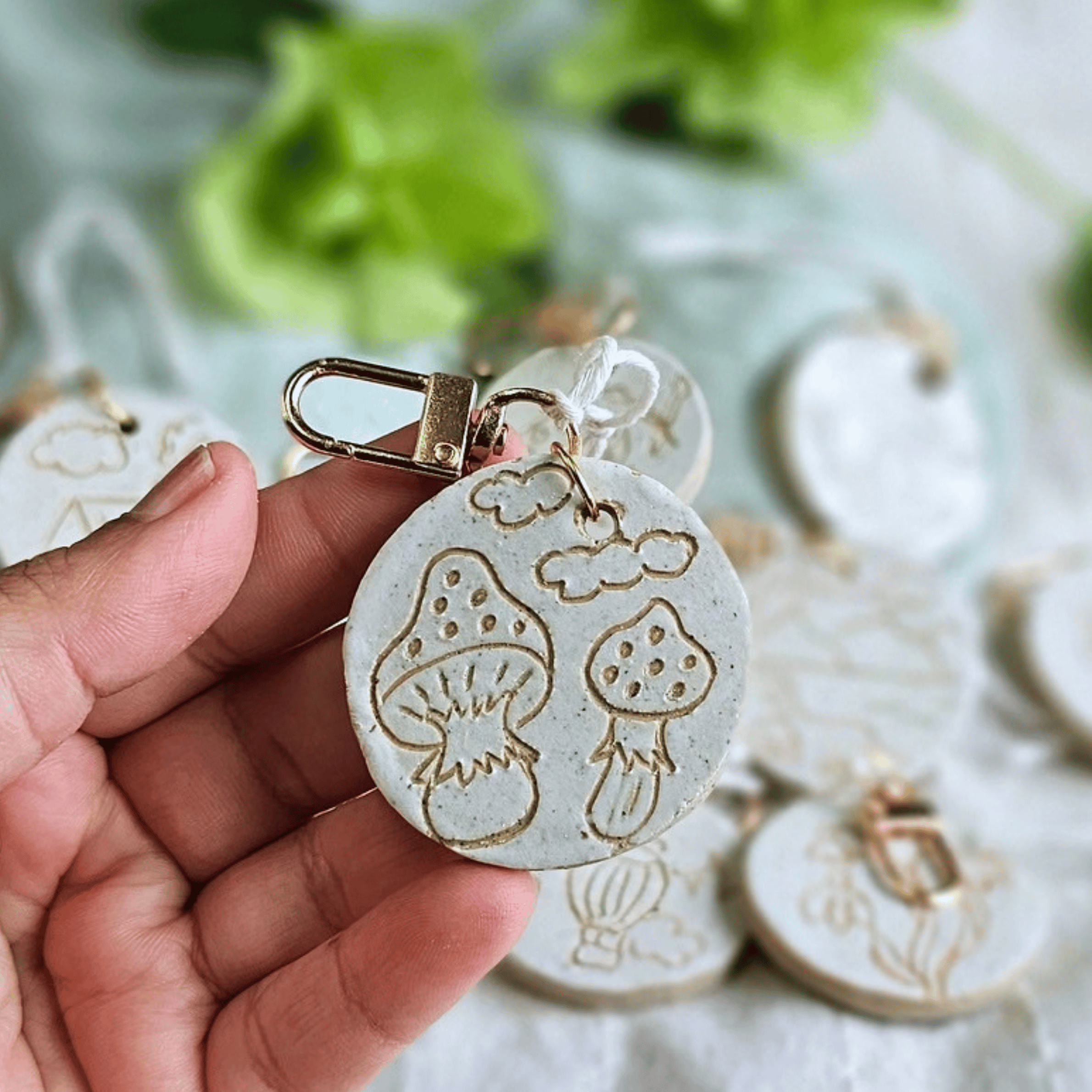 Bag Buddies_sgraffito_white glaze_mushrooms and clouds.png