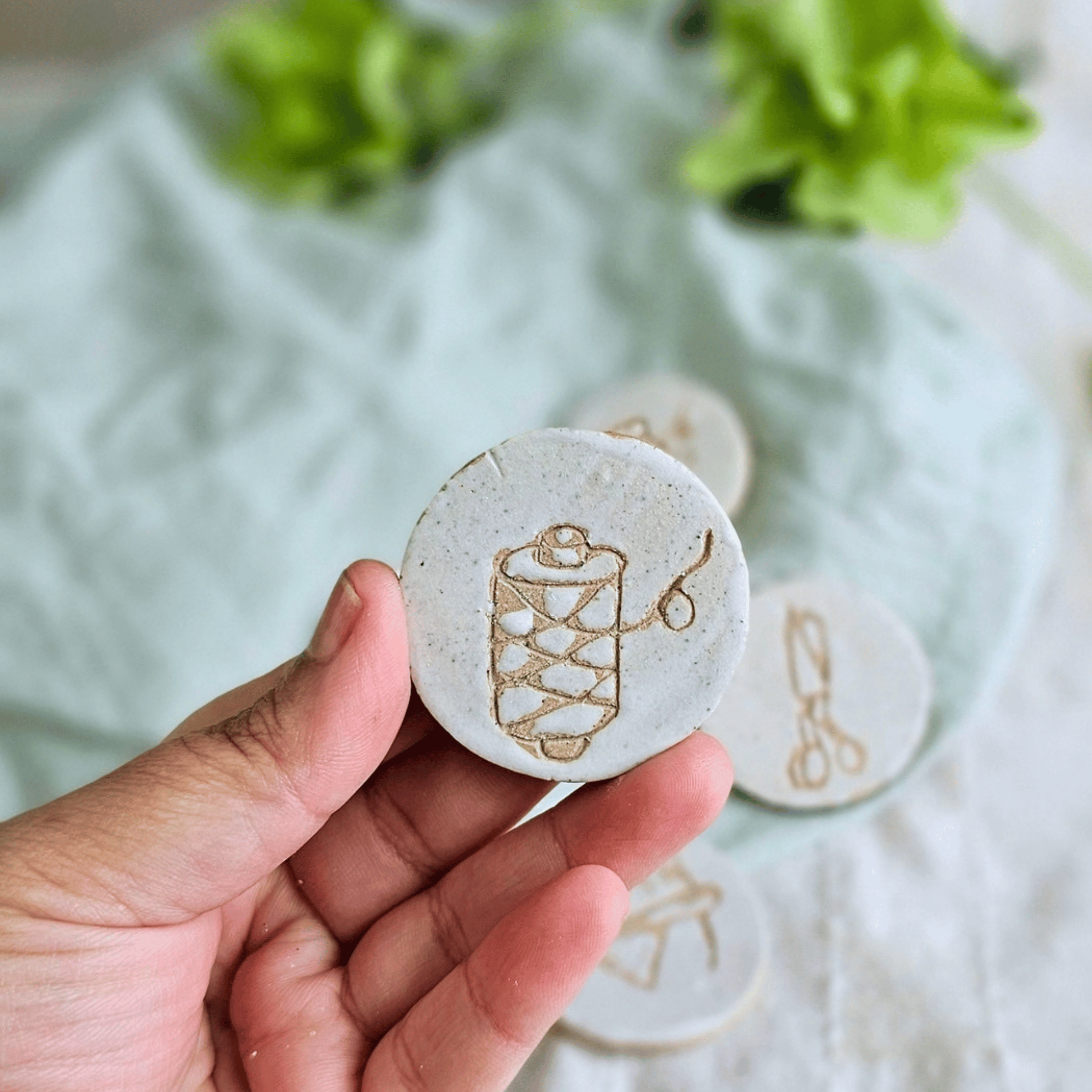 Pattern Weights_sgraffito_white glaze_thread.png