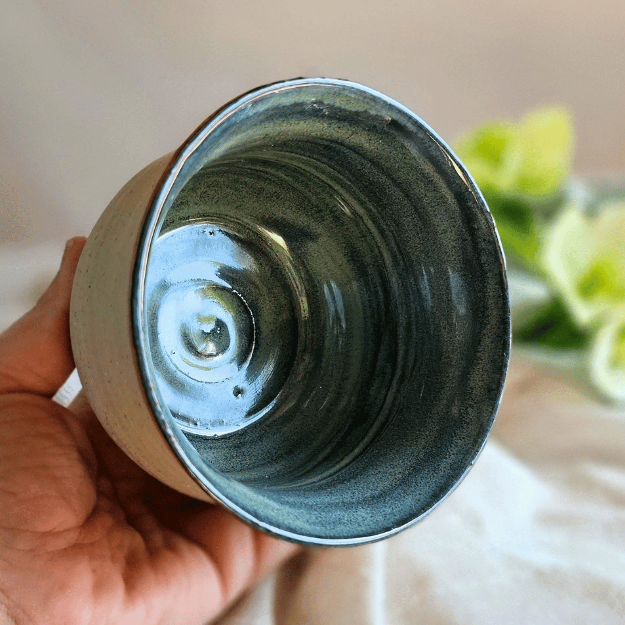Petrichor Bowl_Glazed Interior with Raw Clay Exterior_In hand.png