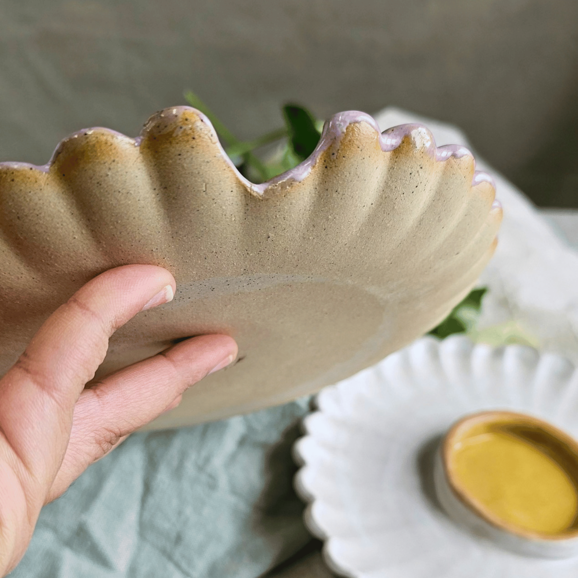 Girl Dinner Plates_Flower shaped_pink yellow_in hand_bottom.png