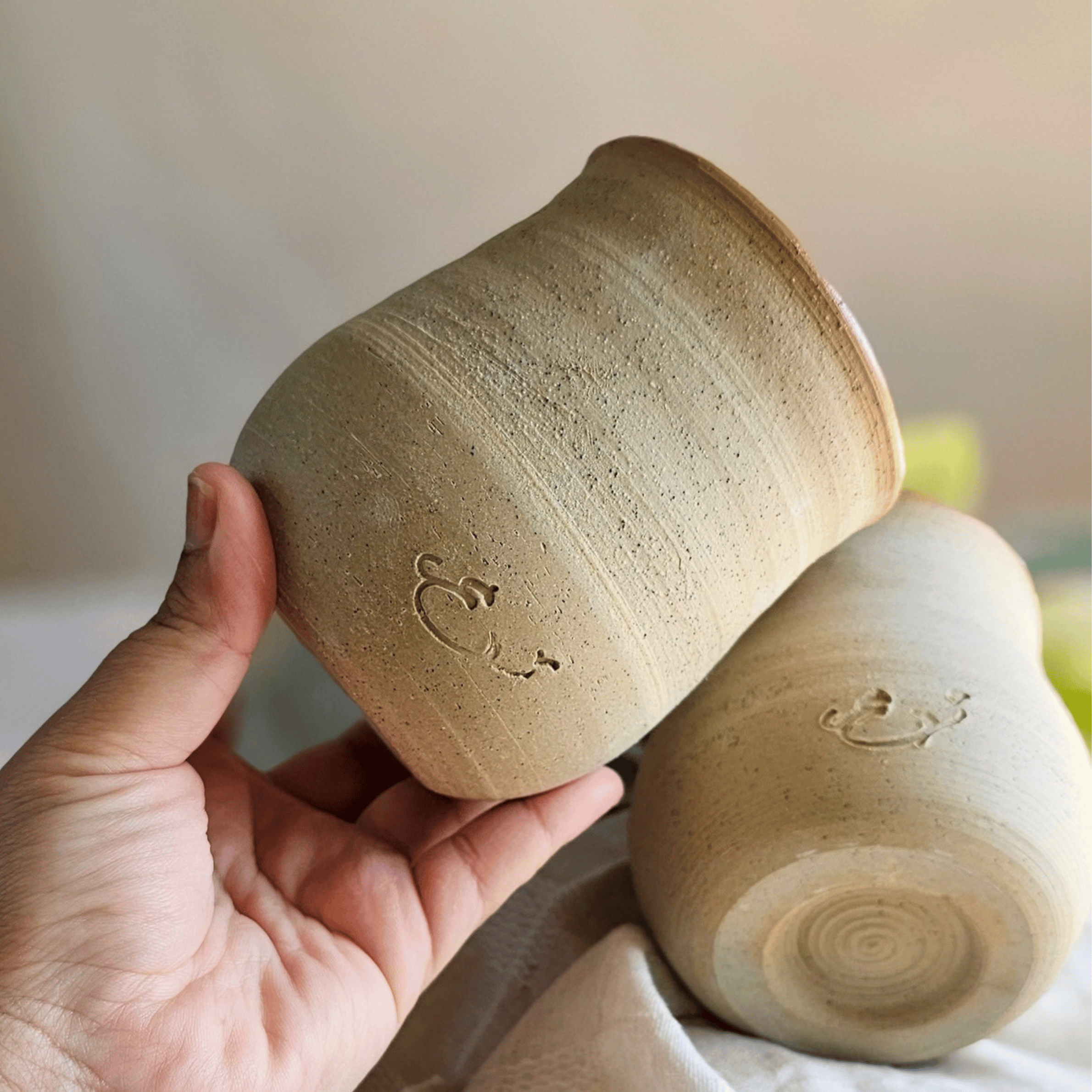 Cosy Cups or Bowls_raw clay fishish_bottomoutside.png