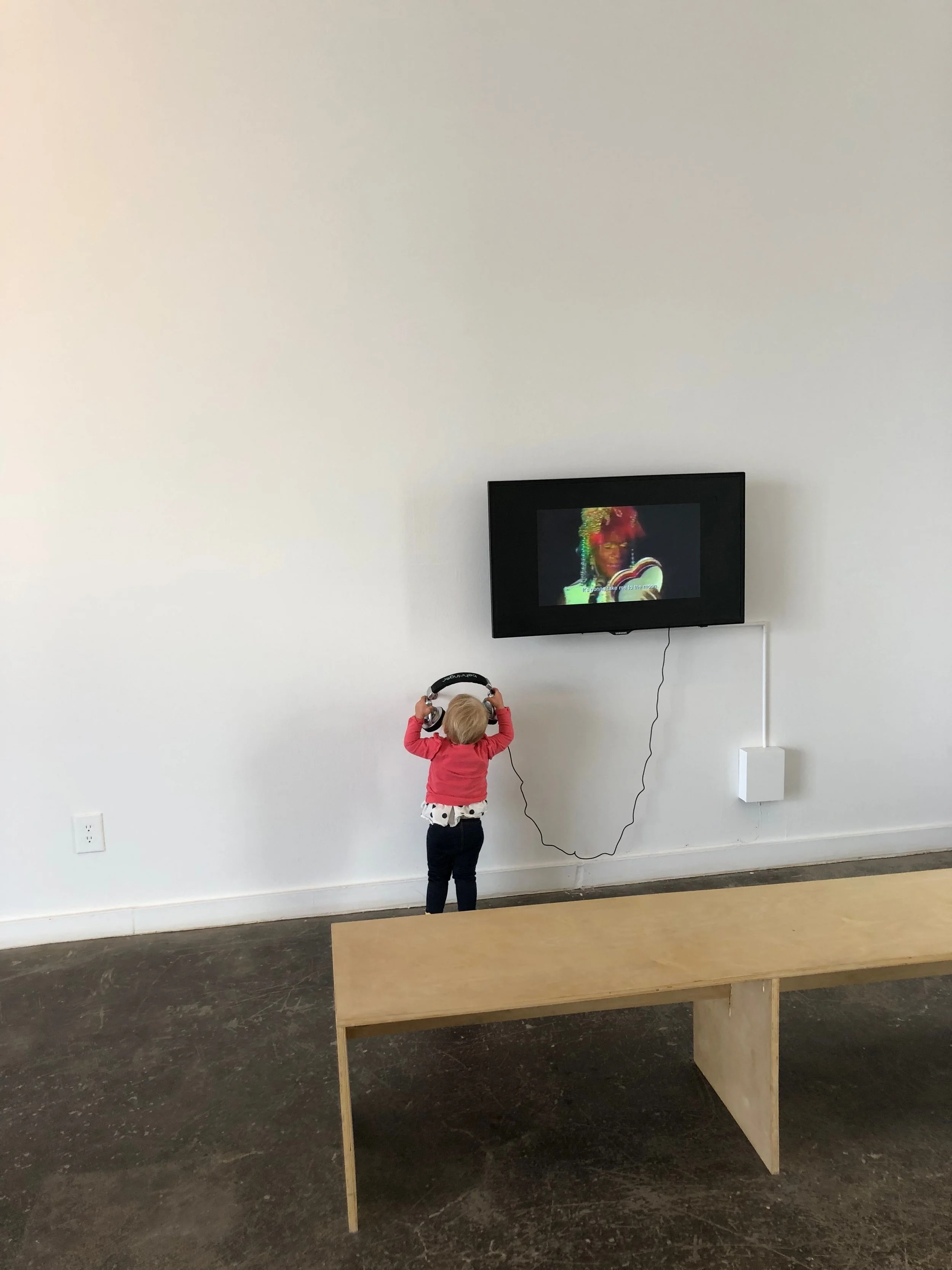 Gracie enjoying the multimedia exhibits at Ballroom