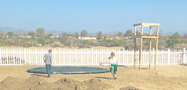 When the kids first saw the trampoline in the ground.