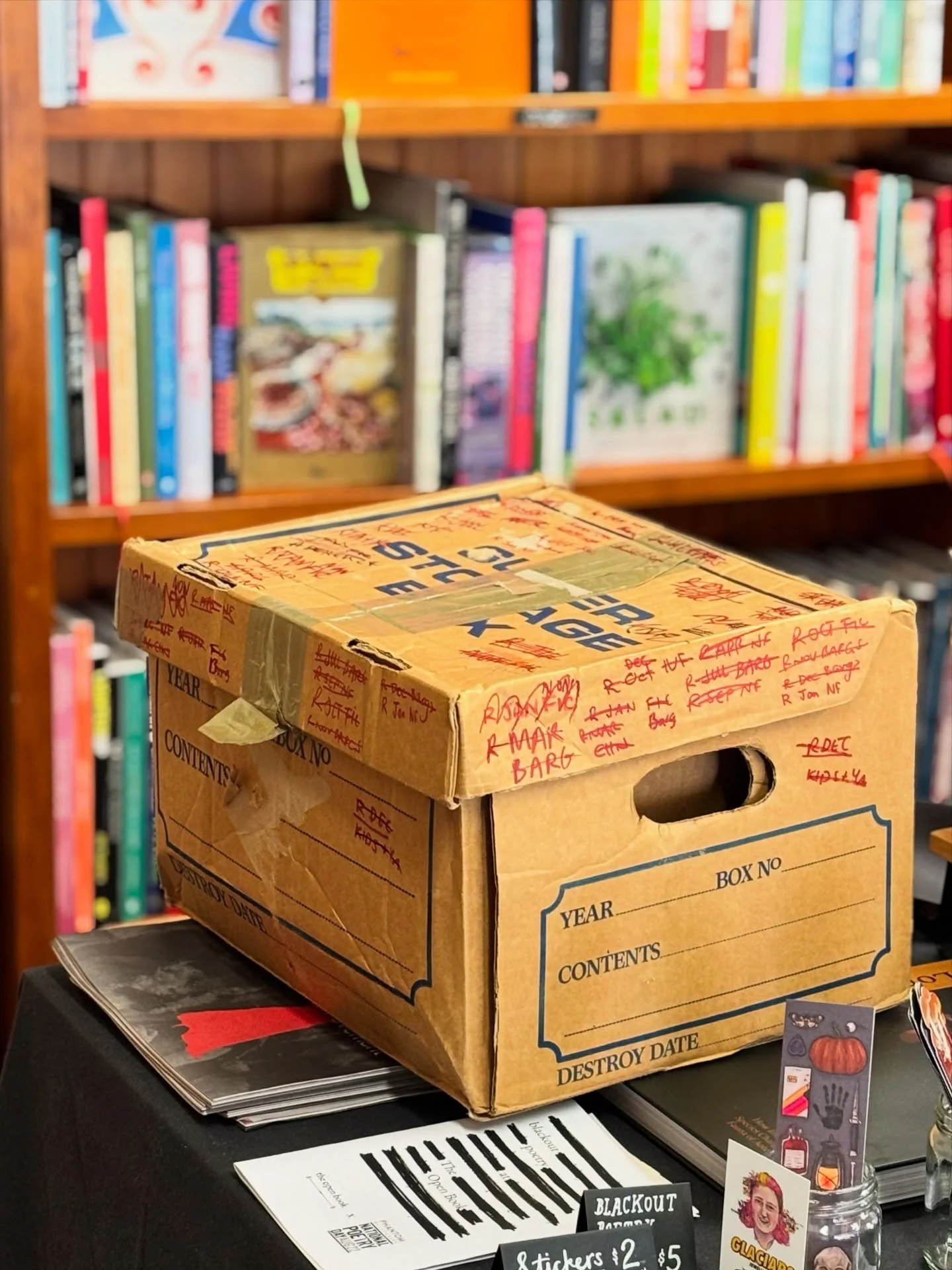 Behold the humble file box, one of the cornerstones of our secondhand bookstore (the other three being our staff, books, and vibes, of course)

We use file boxes like these for storing books because they&rsquo;re easy to open, easy to stack, and usua