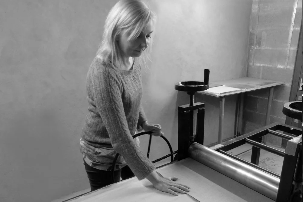 Magda at her printing press.