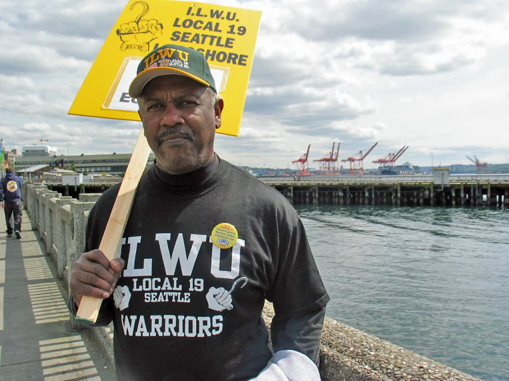 Wikimedia Commons, WikiGolightly, https://commons.wikimedia.org/wiki/File:Seattle_ilwu_19_longshore_worker_protests_iraq_war.jpg