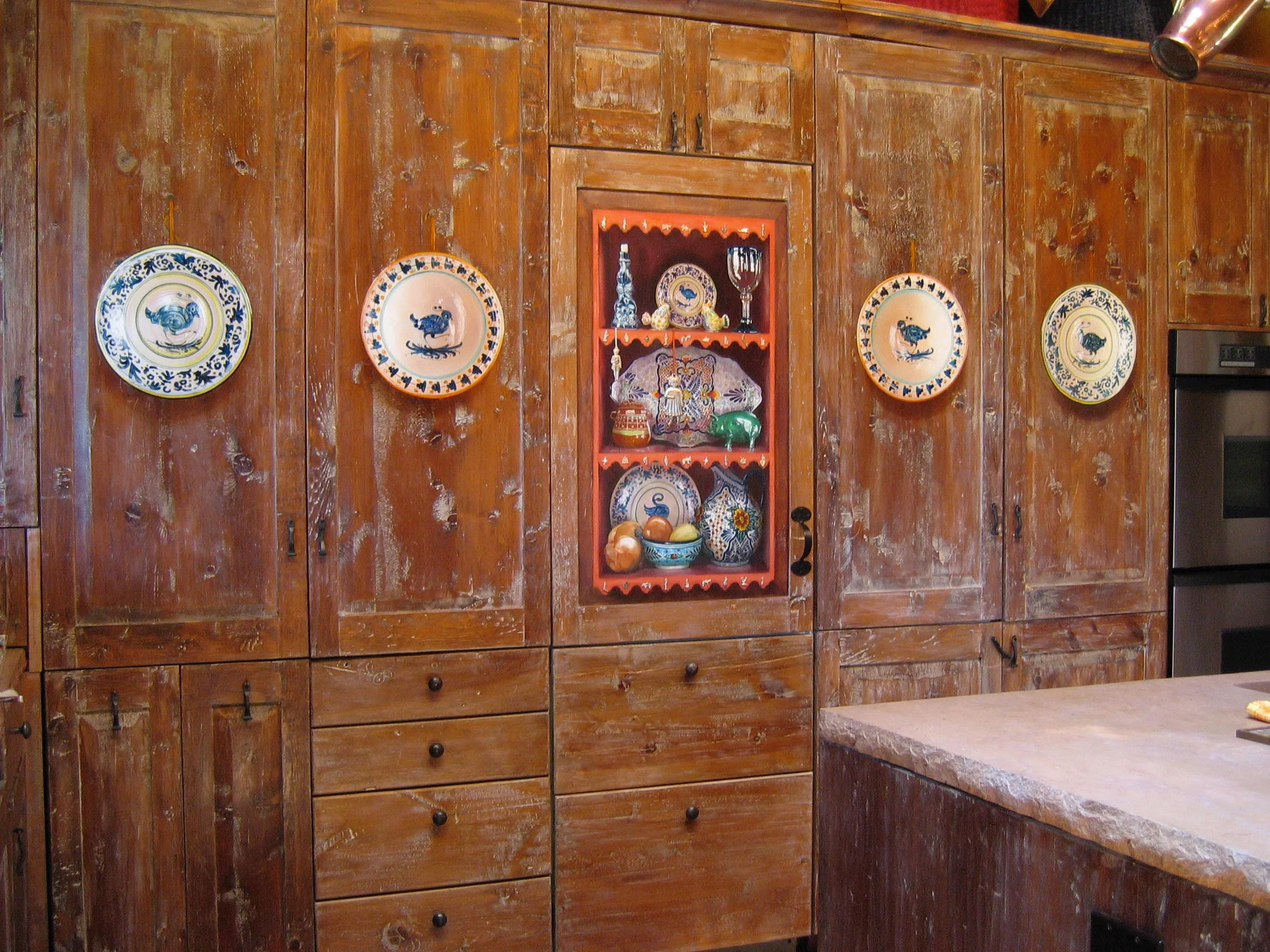 Trompe l'oeil plates and shelves with objects, painted on cupboard doors