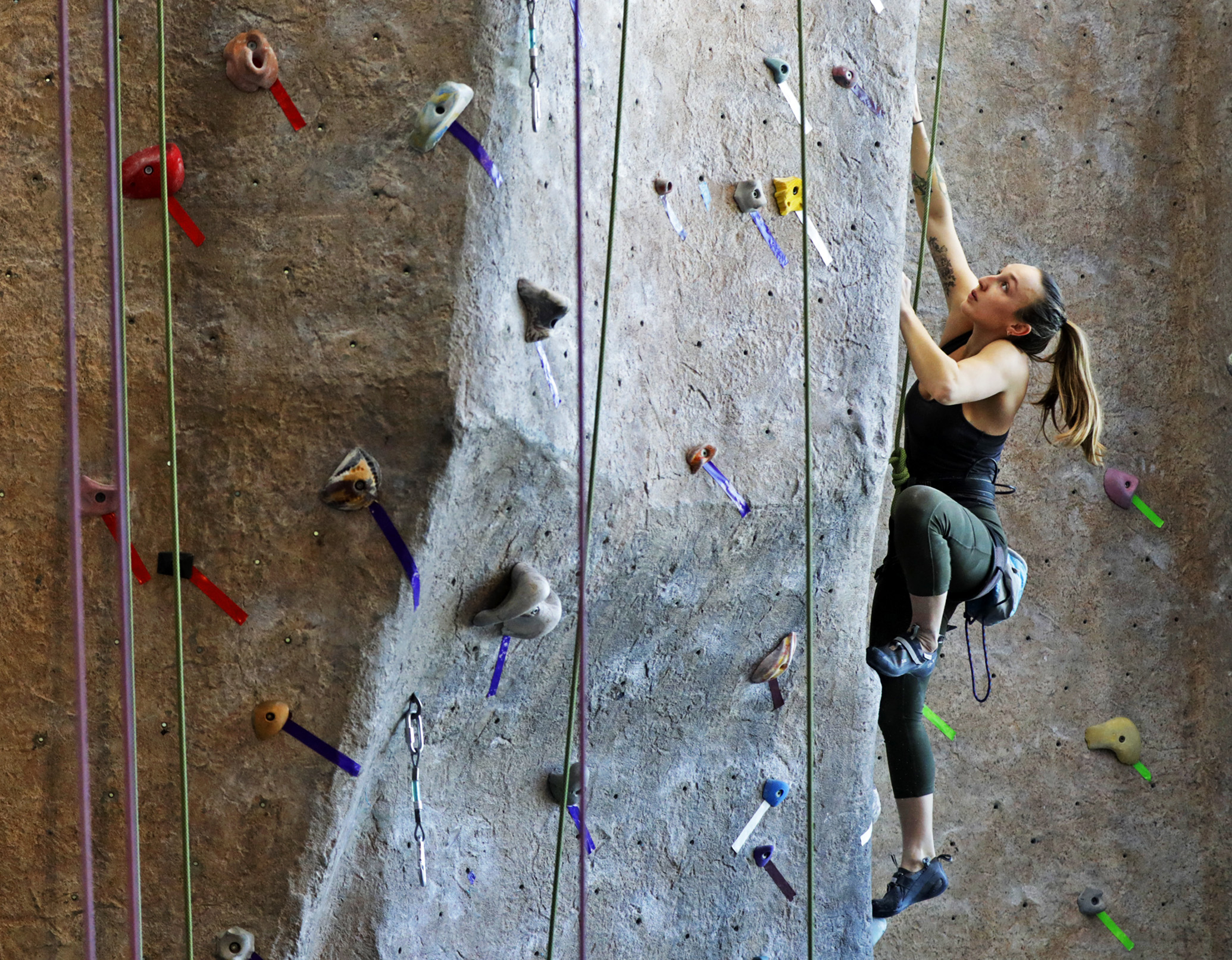 Sierra McMurry scales a route on the rock wall early in the Rock the Rec climbing competition held at the University of Montana Fitness and Recreation Center in Missoula, Mont., on Sunday, March 10, 2019. Each of the routes put up for Sunday's compe