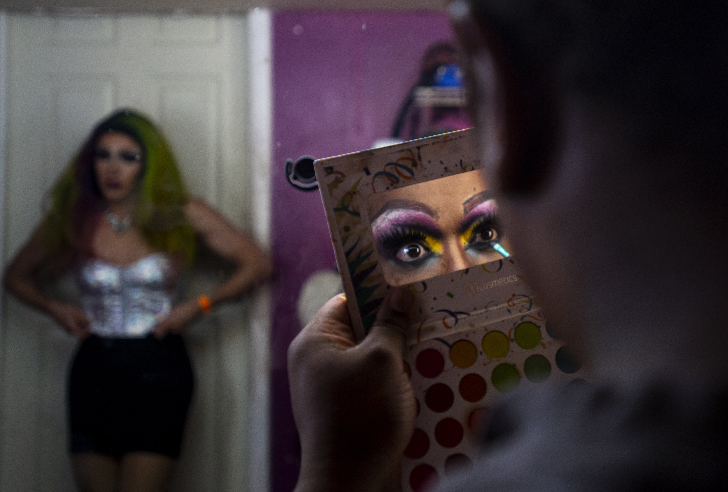  From left, Autumn Quinn and Porsha DeMarco-Douglas, performers, entertainers and drag queens at Club Q in Colorado Springs, Colo., prepare for a show on an evening in early June, 2019.  