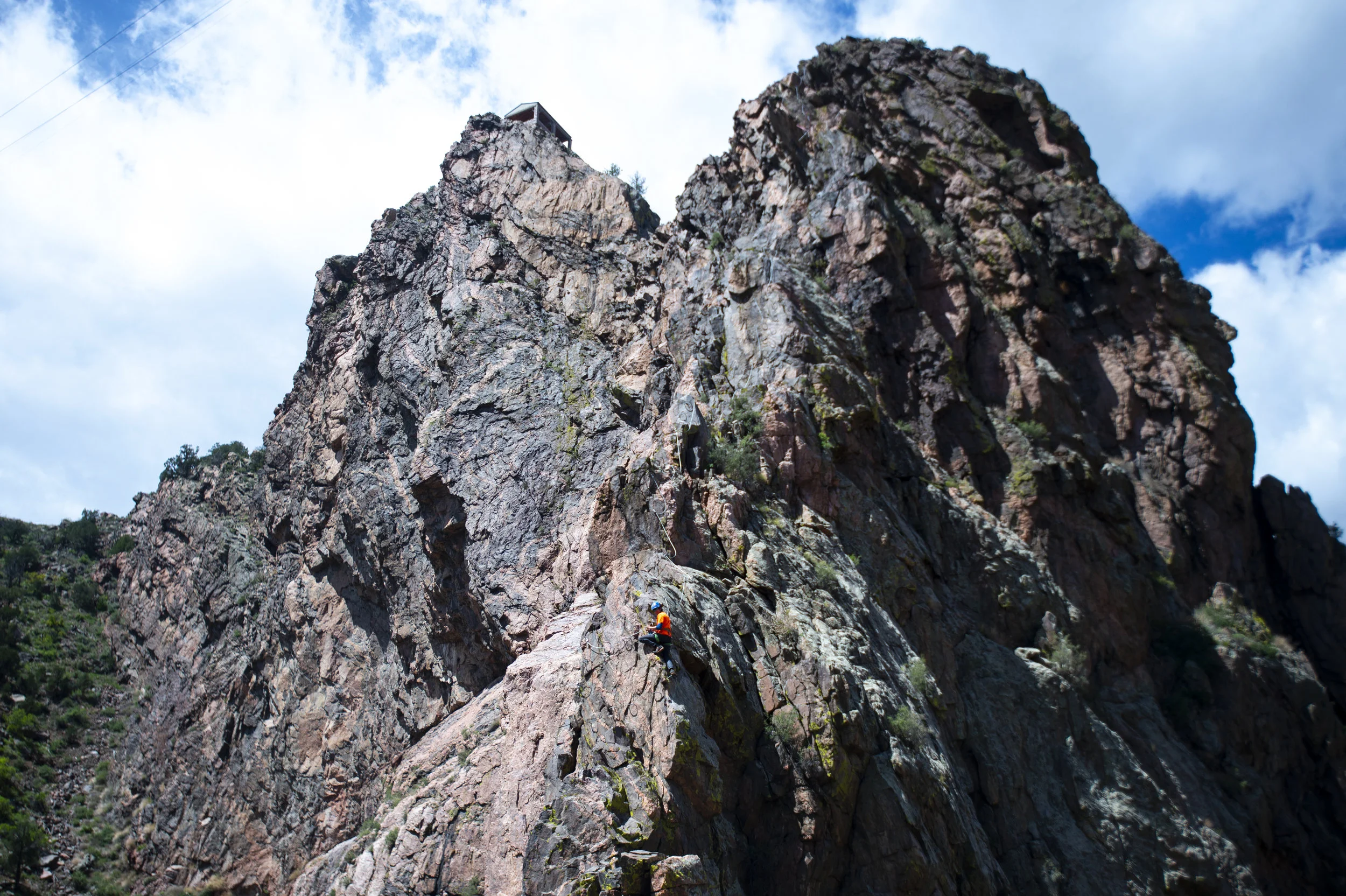  Névé Savelli, an employee at Adventure Partners, the company that built the via ferrata course, climbs up a more advanced portion of the course on Wednesday, May 22, 2019.  