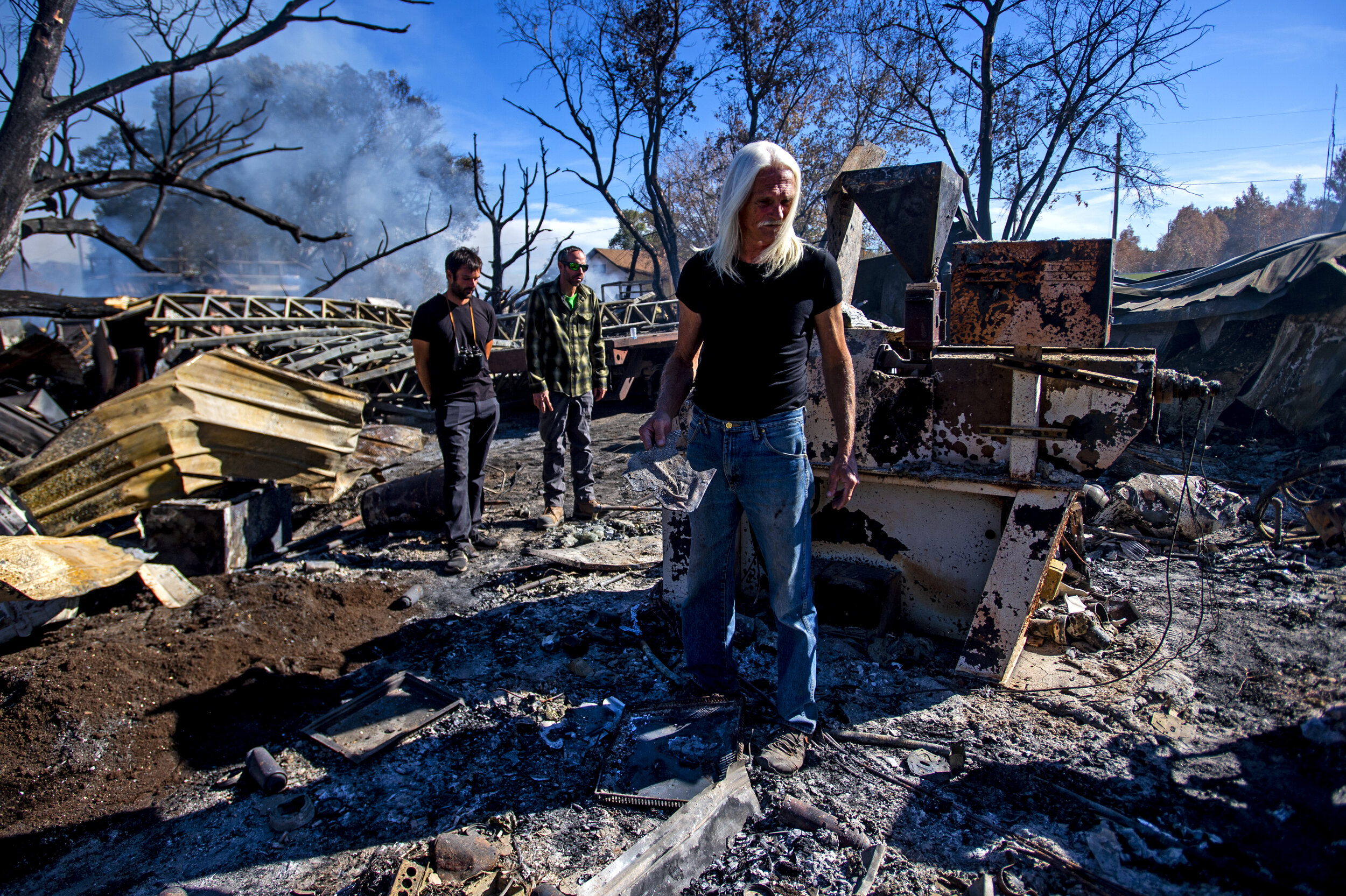  Bill Vestal stands in the rubble of his home and business in Moffat, Colo., on Wednesday, Oct. 16, 2019. A juggler and a 17-year-resident, he watched as a blaze ravaged his home and craft factory for he and his wife's business, Crystal Stix, just fe