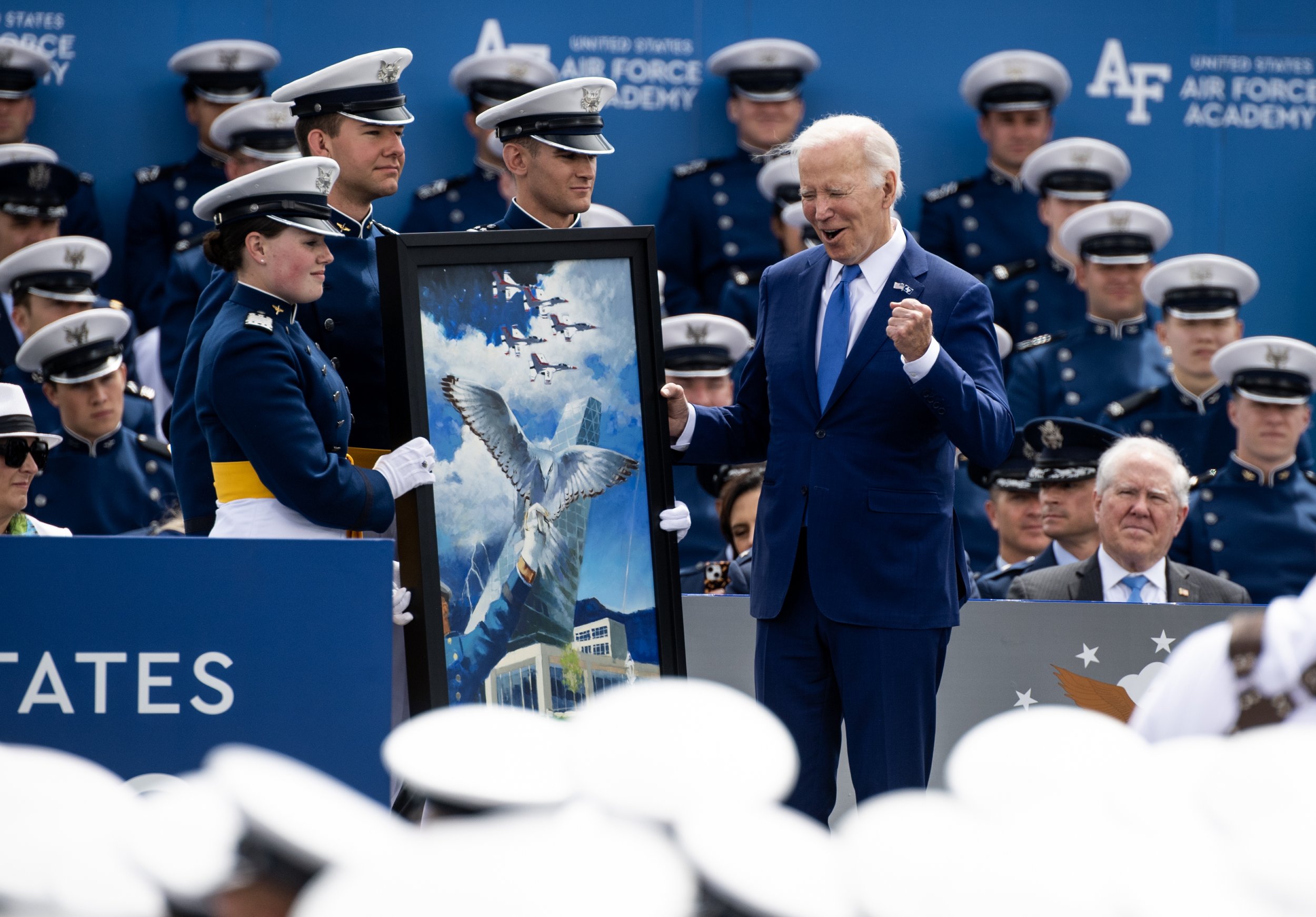  President Joe Biden receives a gift and becomes and honorary member of the Air Force Academy class of 2023 during the Air Force Academy graduation ceremony on Thursday, June 1, 2023, at Falcon Stadium.  