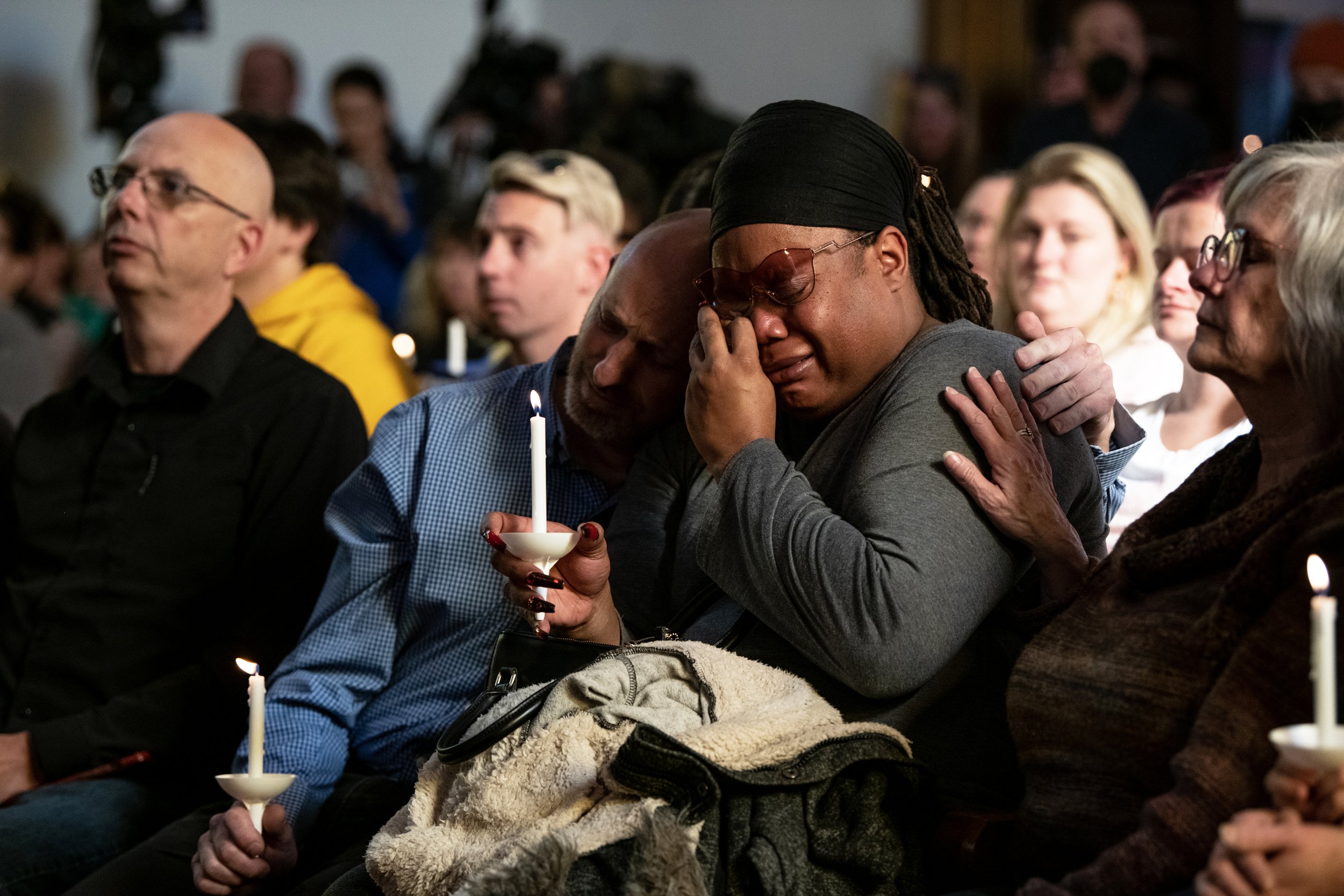  Tyrice Kelley, center right, a performer at Club Q, is comforted by Nic Grzecka, center left, one of the club’s owners, during a service held at All Souls Unitarian Church for people to mourn on Sunday, Nov. 20, 2022, following the mass shooting tha