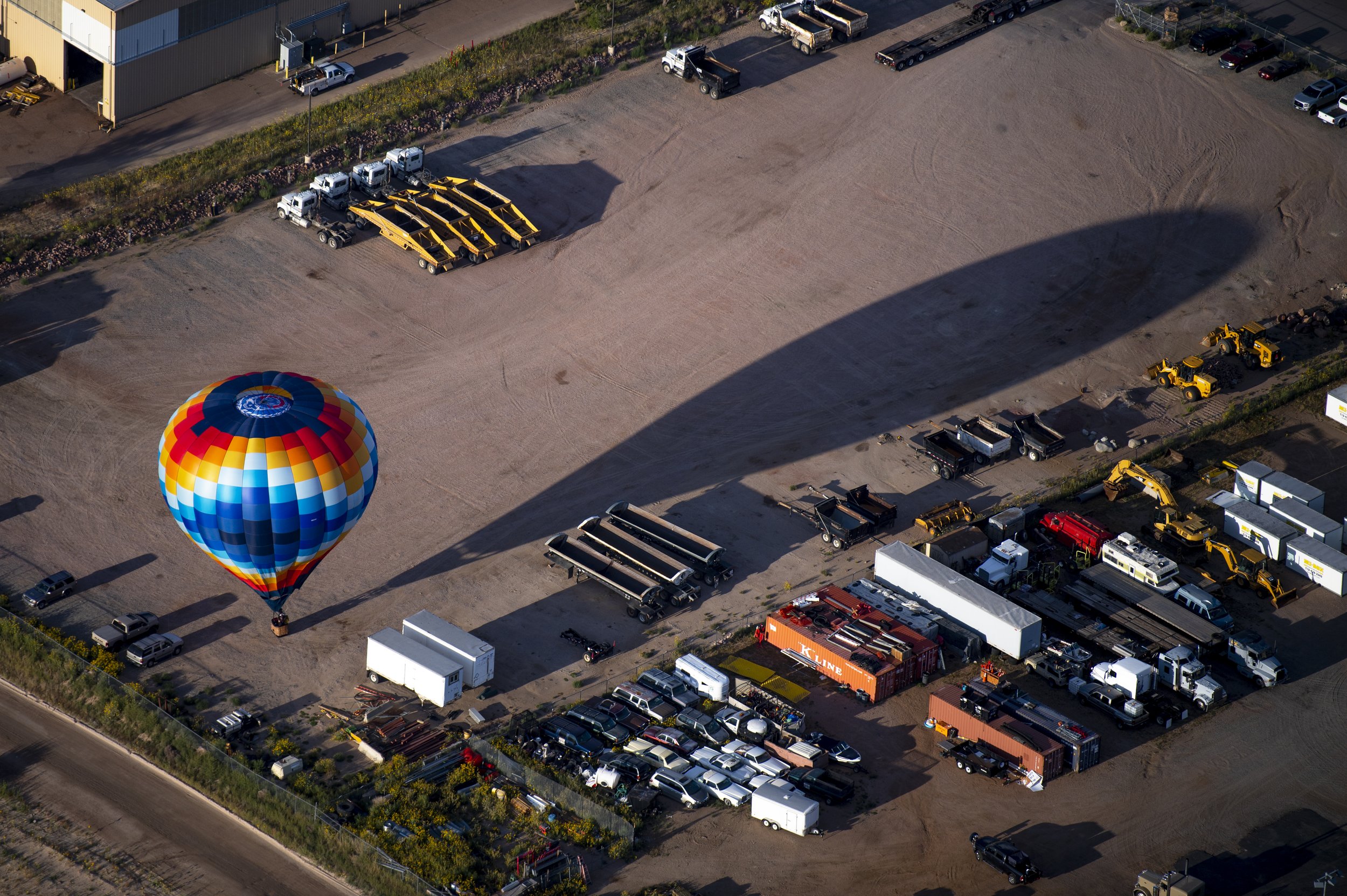  A hot air balloon casts a shadow as it lands during Labor Day Lift Off on  Friday, Sept. 2, 2022, in Colorado Springs, Colo.  