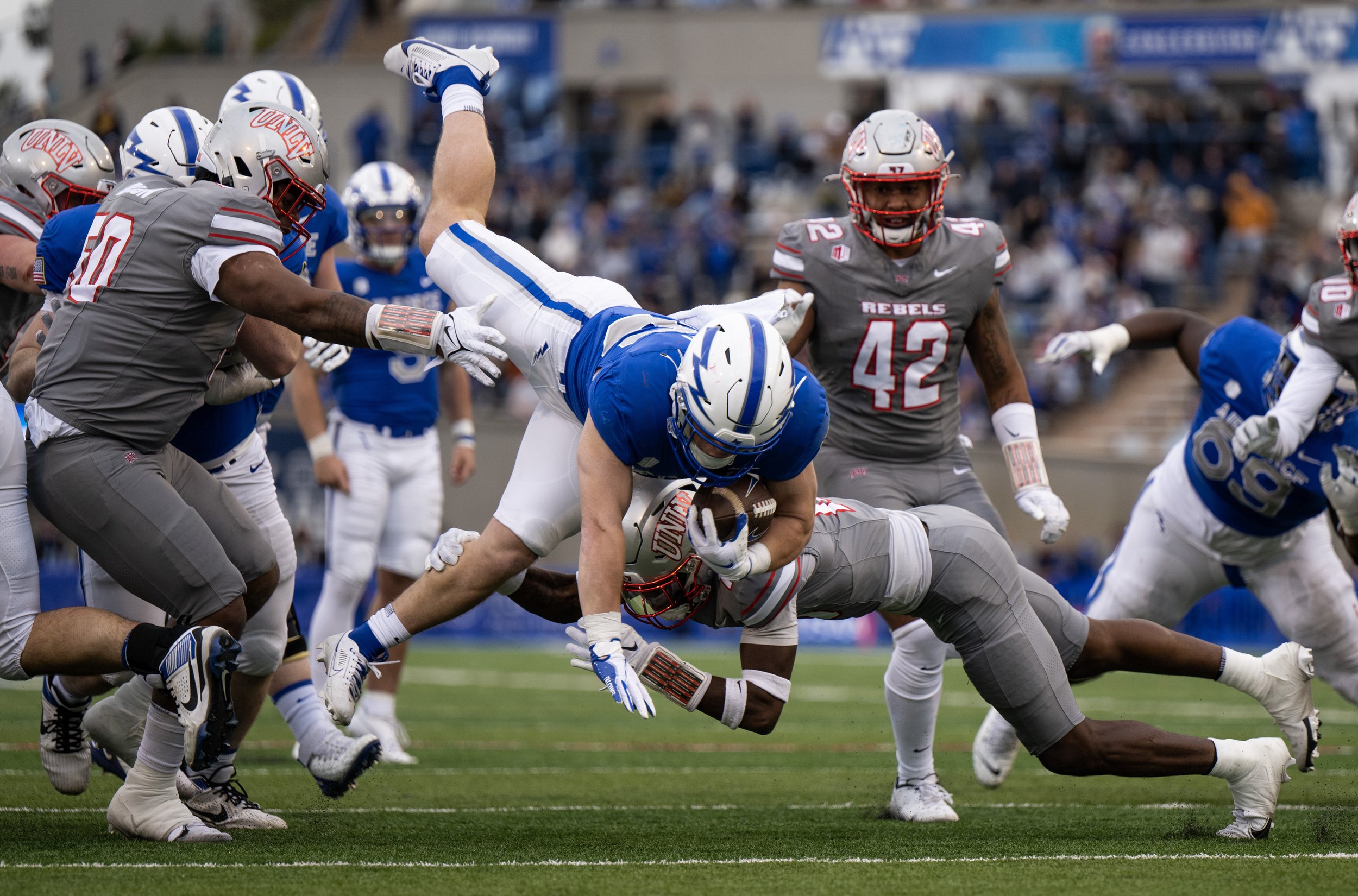  Air Force Falcons running back Owen Burk (26) is tackled by University of Nevada Las Vegas Rebels defensive back Cameren Jenkins (13) in the first half of a NCAA football game on Saturday, Nov. 18, 2023, at Air Force Academy, Colo.  
