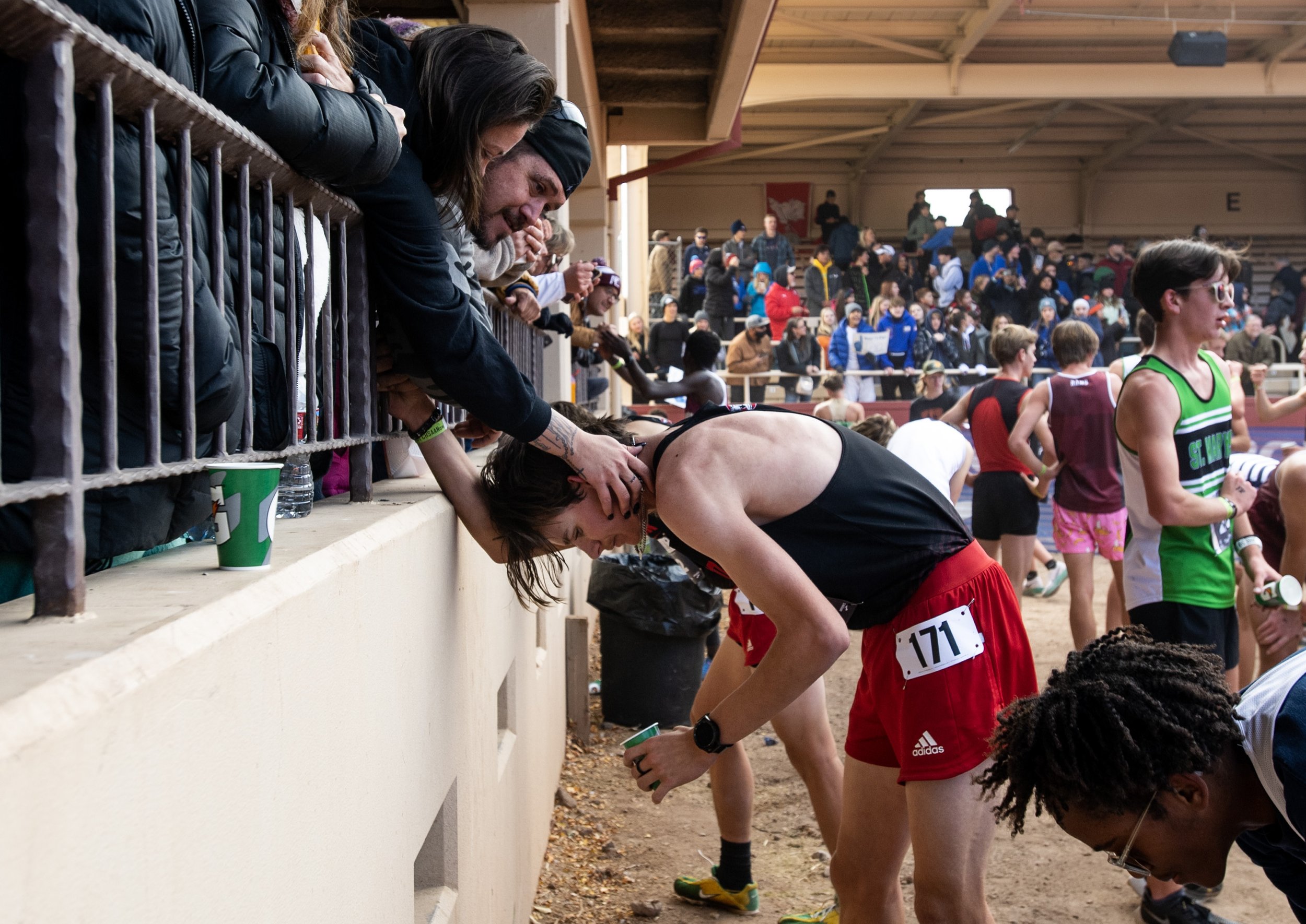  Peyton High School’s Matthew Peery is met by family at the finish line of the 2A boys cross country state championships on Saturday, Oct. 28, 2023, at the Norris Penrose Event Center in Colorado Springs, Colo. 