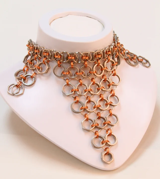  This piece is copper- and silver-colored chainmaille necklace in a Celtic pattern. It's a 17 inch, one-of-a-kind piece with a toggle closure.  Available at:  https://www.etsy.com/listing/105114501/racine-collection-necklace?ref=shop_home_active_86 