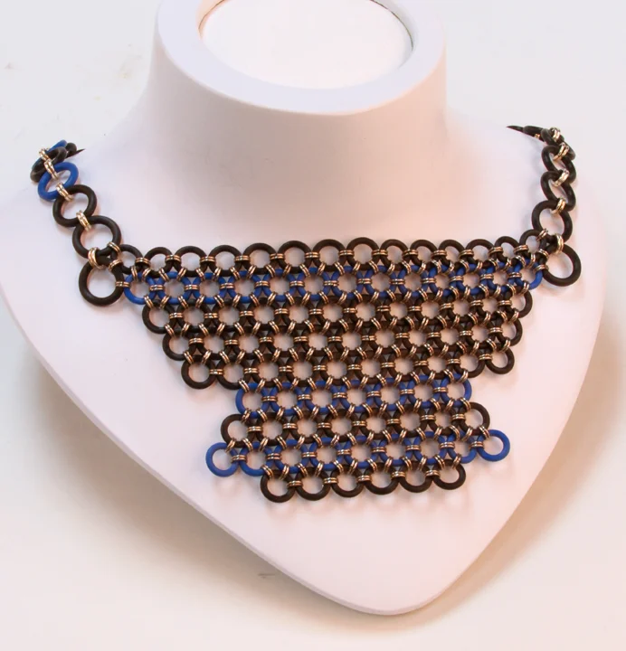  This beautiful, lightweight necklace makes a big statement in Asian-inspired chainmaille! Black &amp; royal blue silicone chainmaille linked with silver-colored rings.  Available at:  https://www.etsy.com/listing/223647122/shiobann-collection-neckla