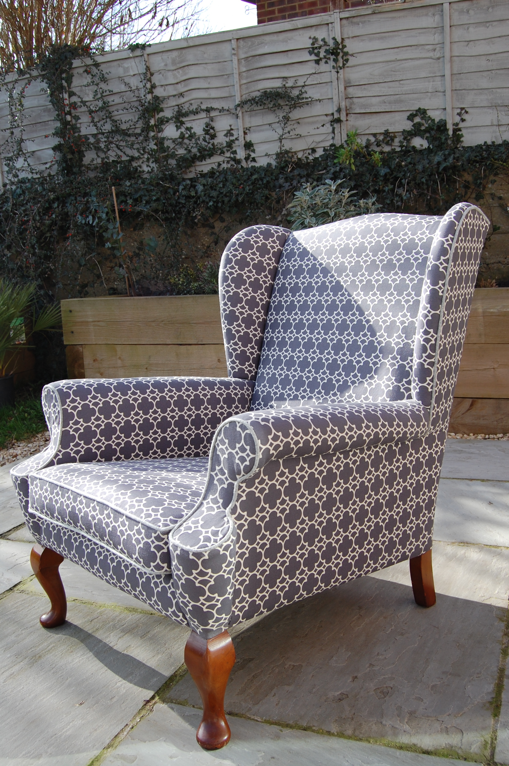 Grist & Twine Upholstery: Mid-century wingback armchair reupholstered in Korla geometric fabric
