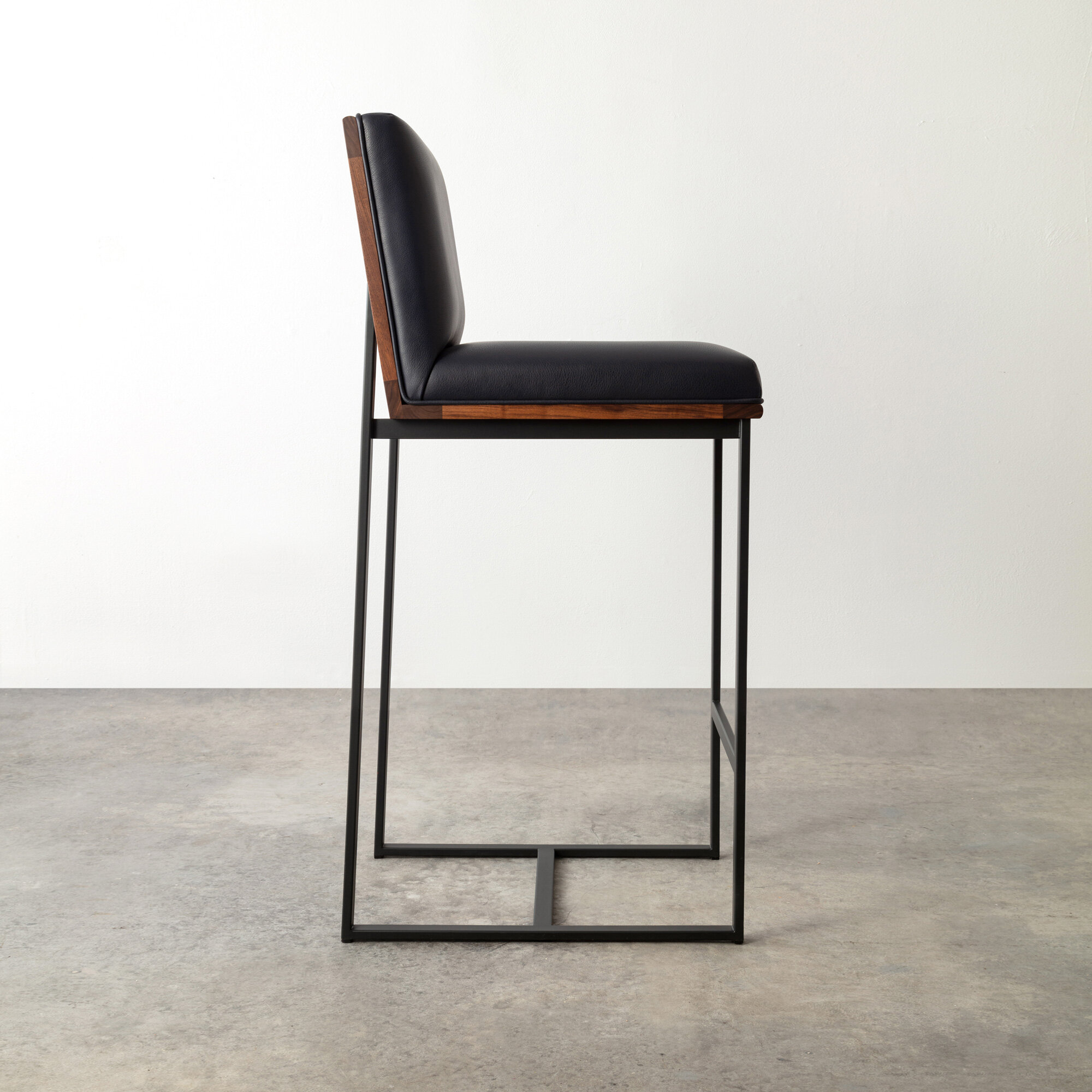 Shown in walnut + leather