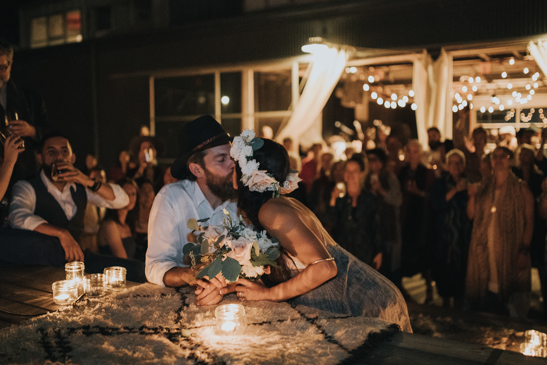 A bride and groom at their candlelit ceremony on Granville Island 