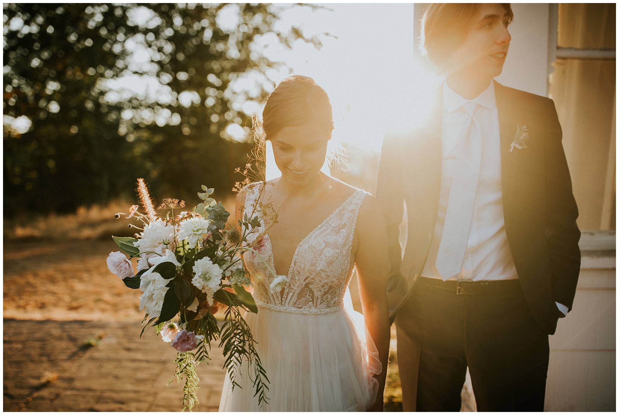 A golden hour wedding portrait by the farm house at Estate 248