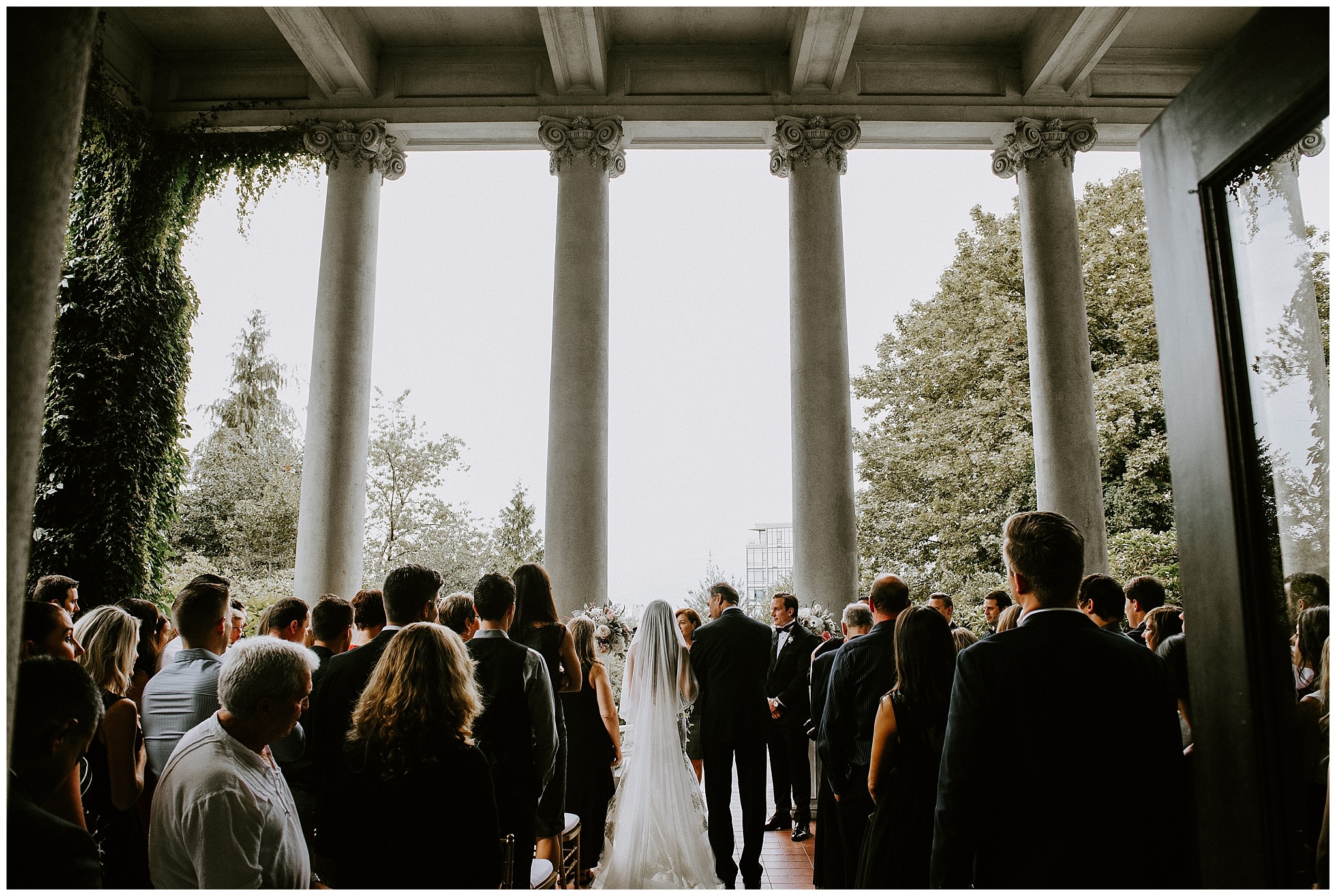 A ceremony photo of a wedding in the courtyard at Hycroft Manor 