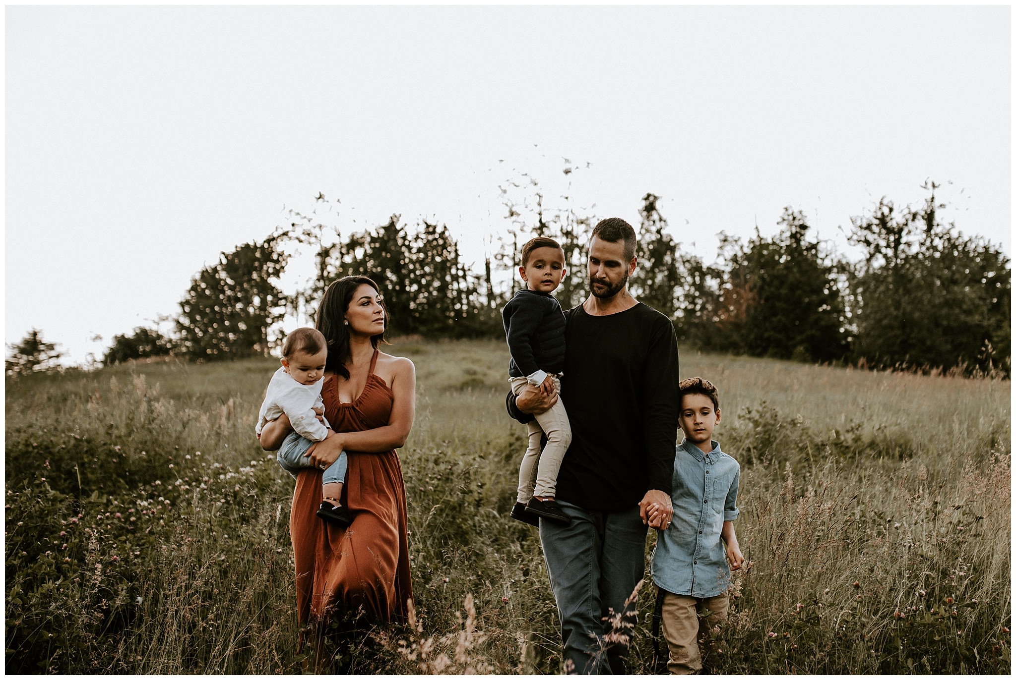 Vancouver family photos in golden light and tall grassy field 
