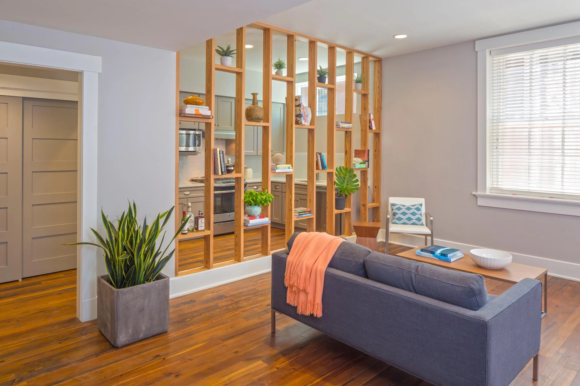 Modern sitting area with soft grey sofa and wooden coffee table