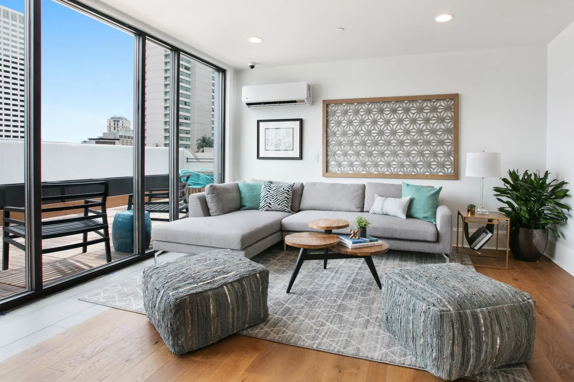 Brightly lit lounge space with floor to ceiling windows and ample seating