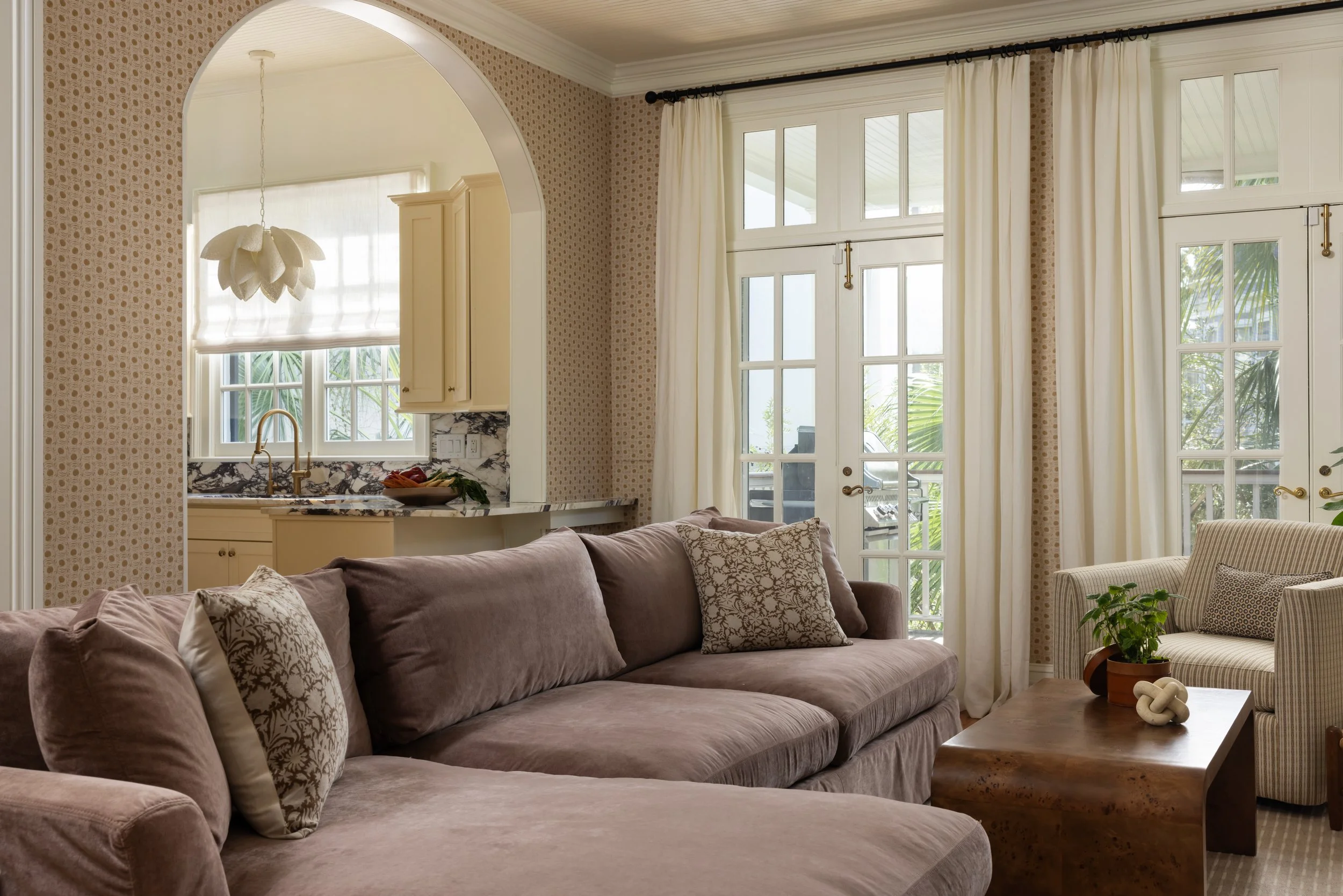living room with mauve sofa and brown coffee table