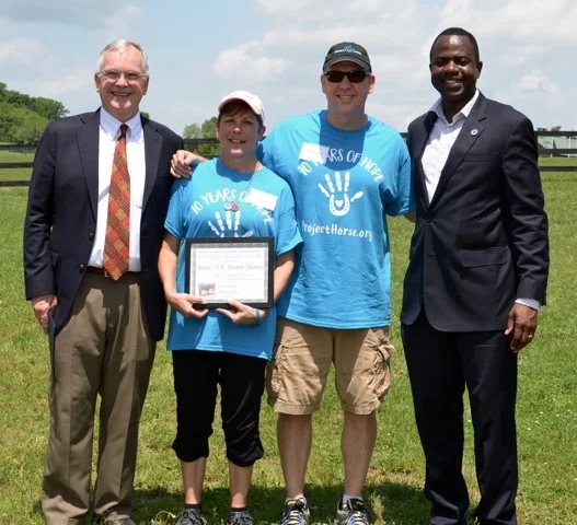 Dave Stegmaier, Darcy & Andrew Woessner, and Mayor Kwasi Fraser