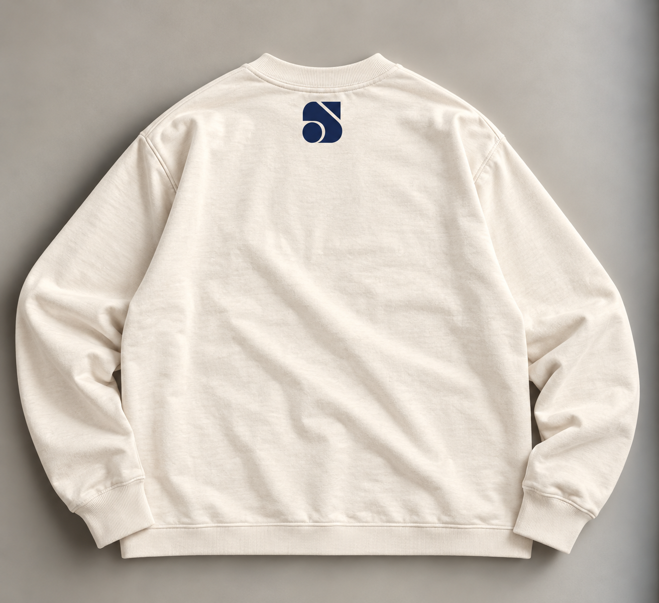 Cream Sweatshirt with Navy Emblem.png