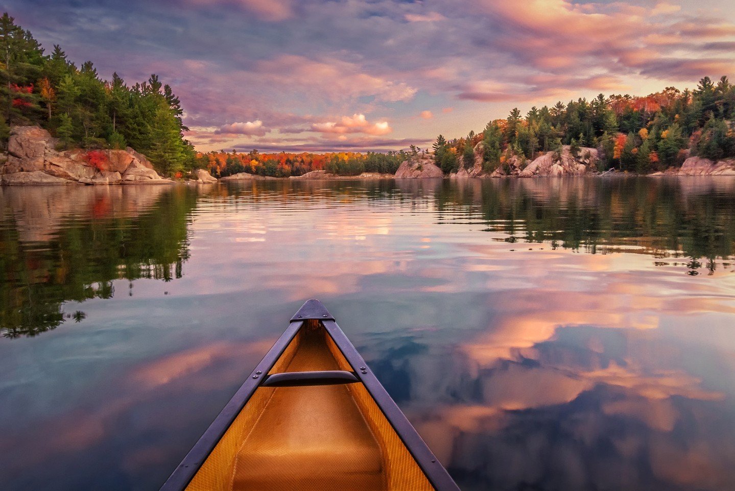 An incredible sunset moment, as we paddled our canoe on George Lake on our last evening of an autumn camping trip in Killarney Provincial Park, Ontario. Fall is a wonderful time to visit Killarney. It can be tough to get reservations in the summer, b