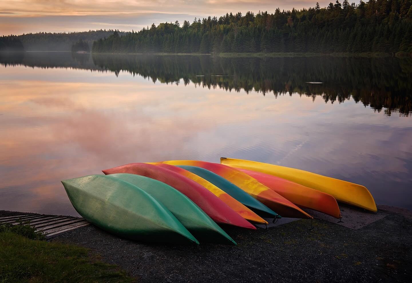 A beautiful, serene moment while we were camping in Fundy National Park, NB. We went to Bennett Lake for sunset, and it did not disappoint! These kayaks stacked next to the lake were the perfect pop of colour in the foreground.

For me, this is a &ld