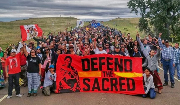 Members of the Standing Rock Sioux Tribe and supporters protest the Dakota Access Pipeline, 2016 / Photo source: Sacred Stone Camp Facebook page